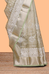Sage green unique design art tissue saree with self zari border and matching blouse