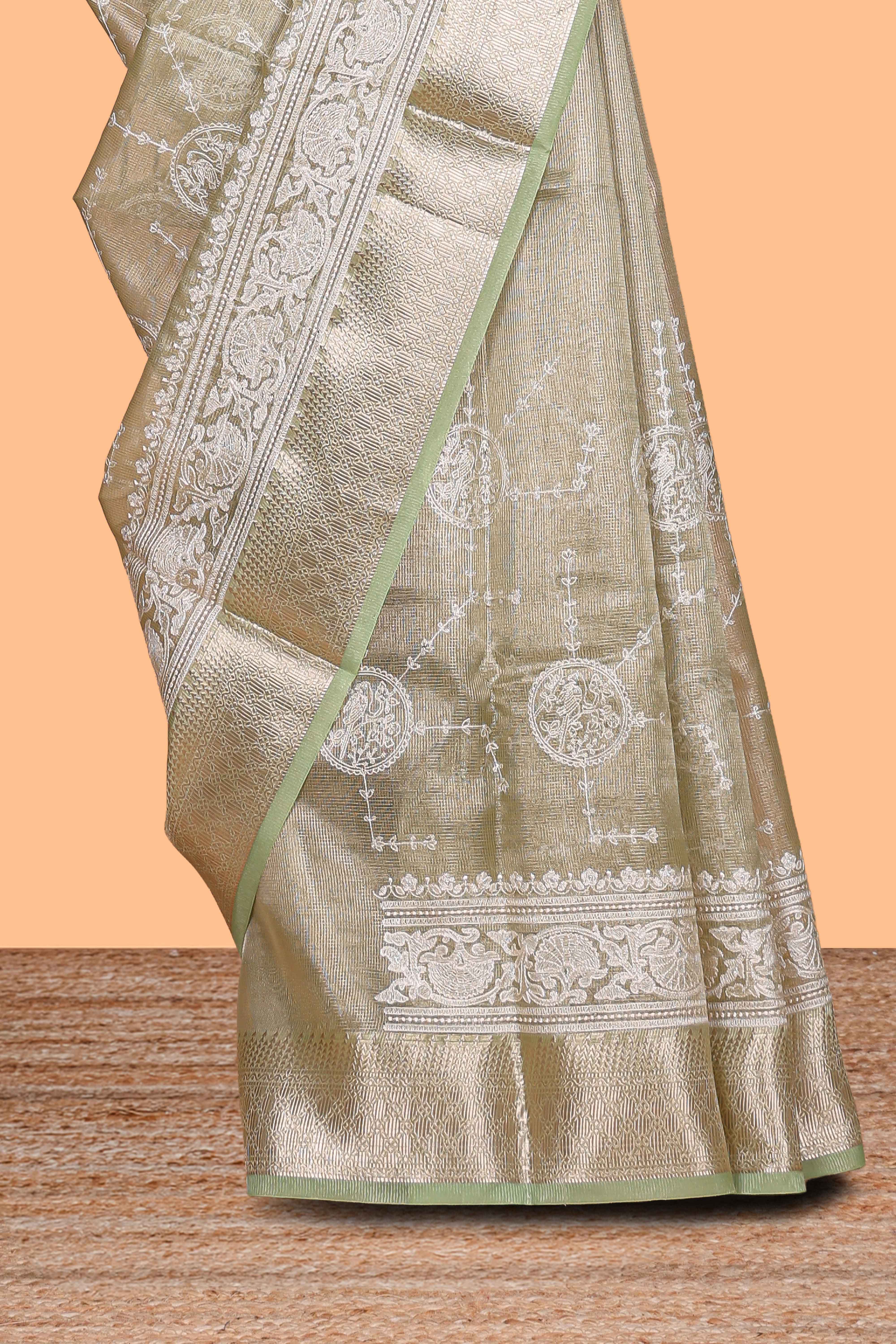 Sage green unique design art tissue saree with self zari border and matching blouse