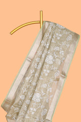 Pale green floral design art tissue saree with self zari border and plain blouse