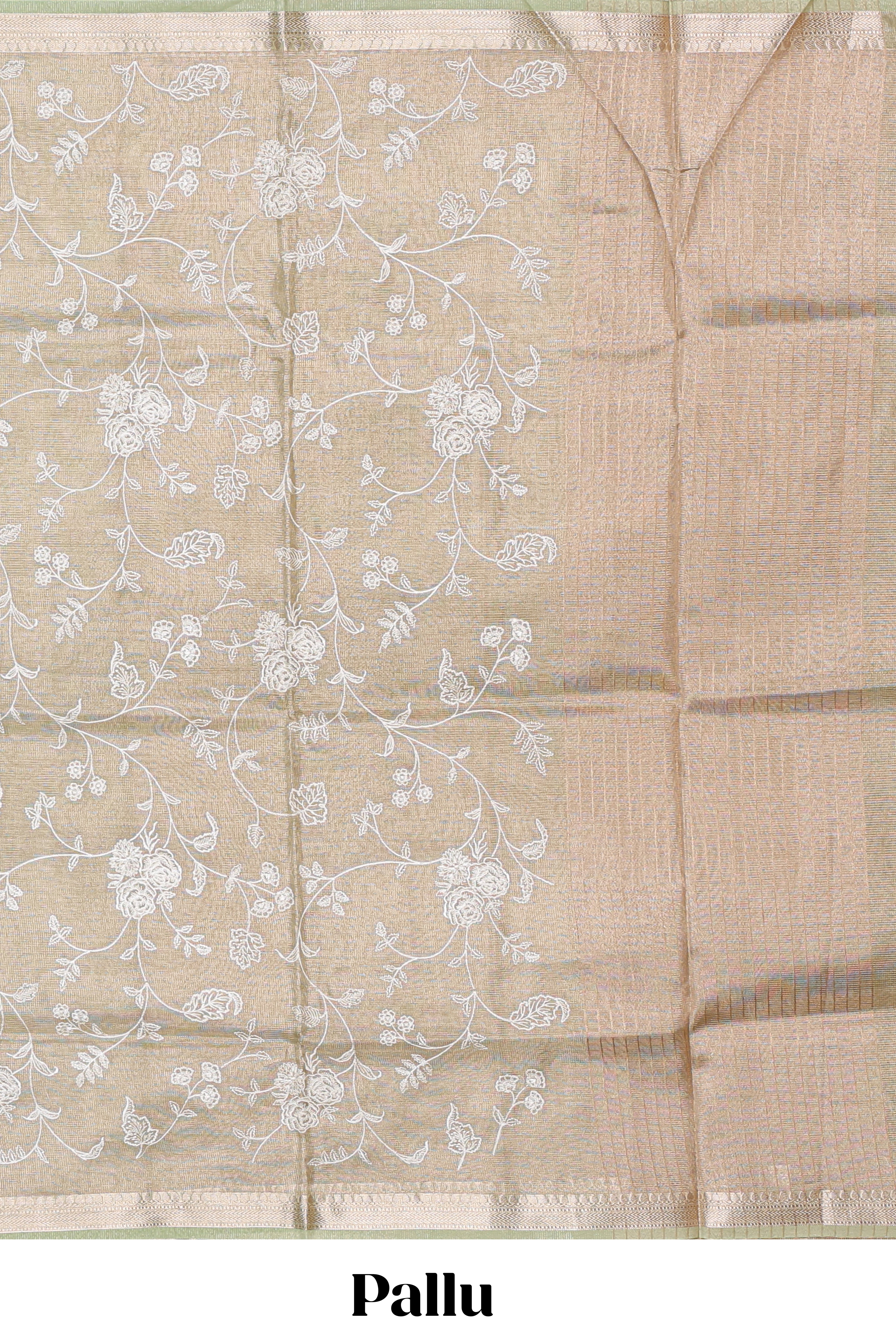 Pale green floral design art tissue saree with self zari border and plain blouse