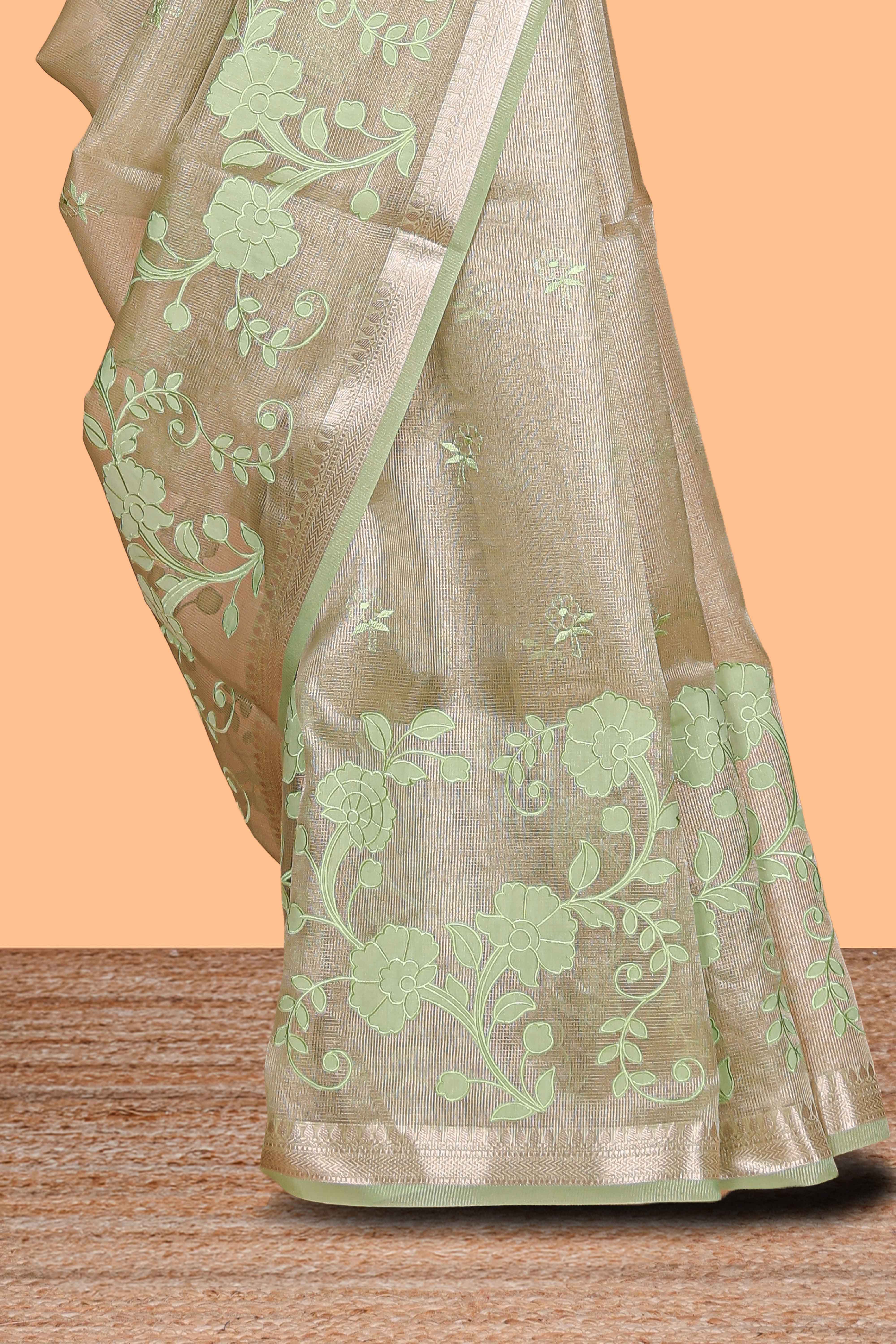 Moss green floral design art tissue saree with zari border and Plain blouse
