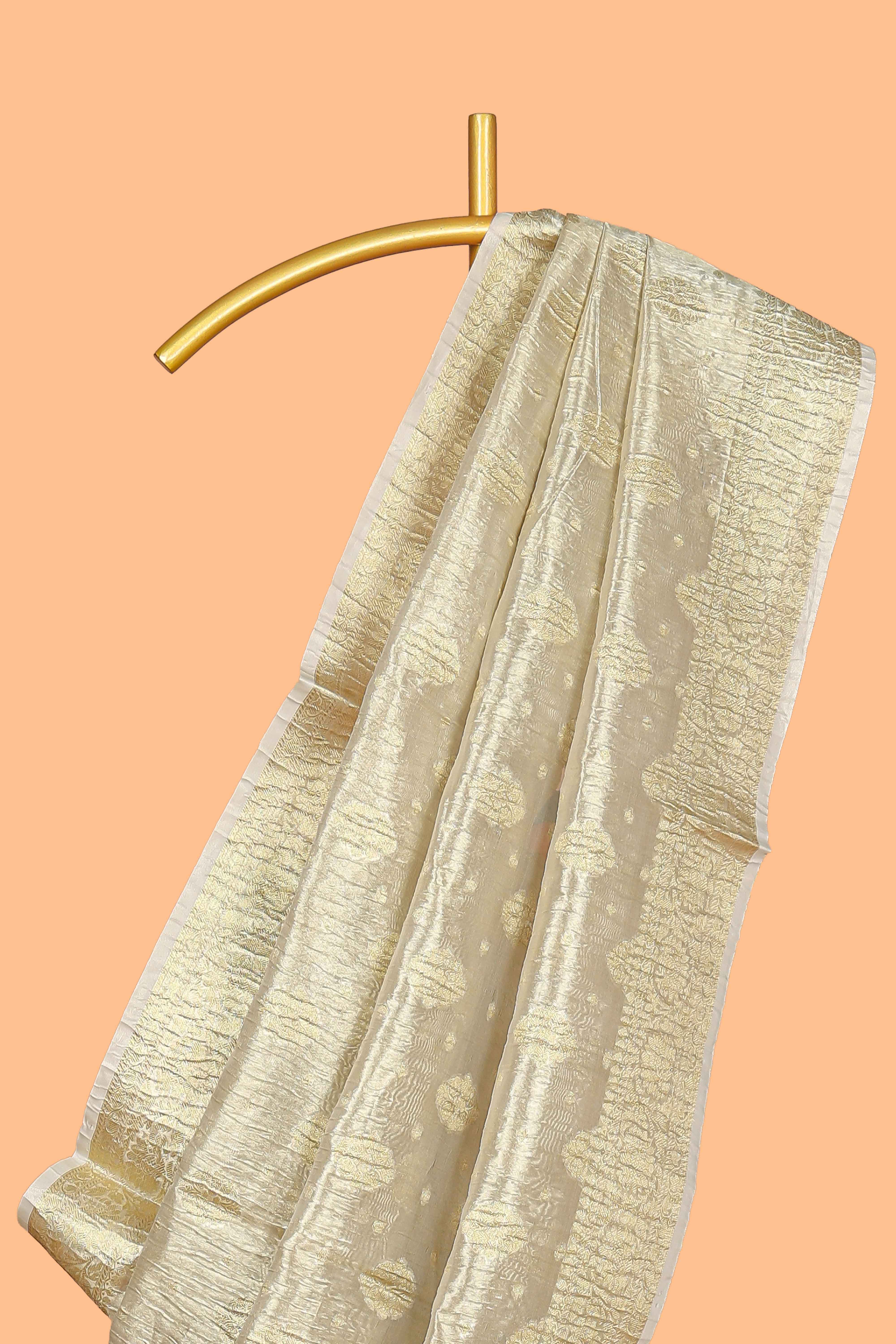Gold color butta designs art tissue saree with zari border and plain blouse