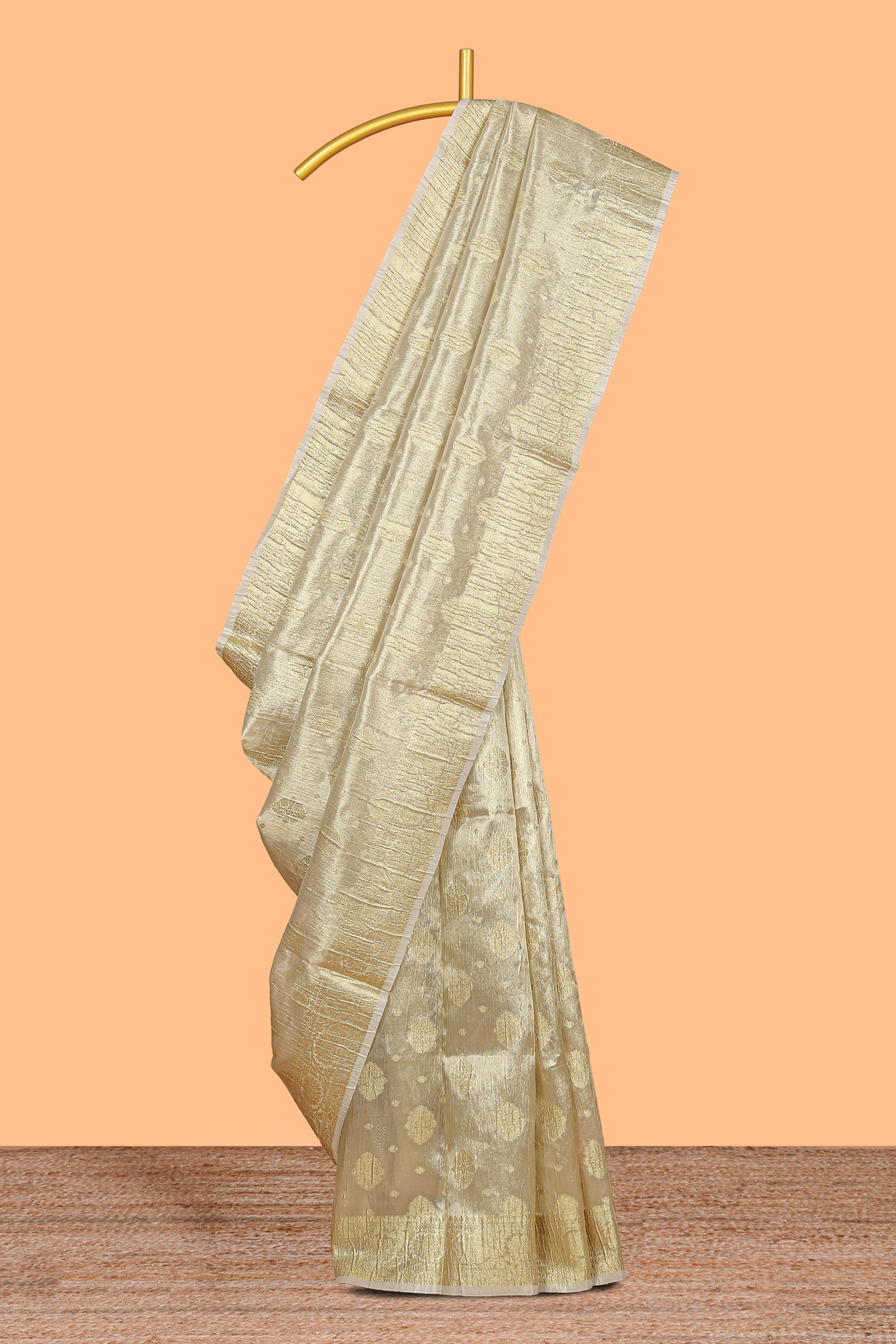 Gold color zari butta design art tissue saree with self zari border and Matching blouse