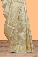 Gold color zari butta design art tissue saree with self zari border and Matching blouse