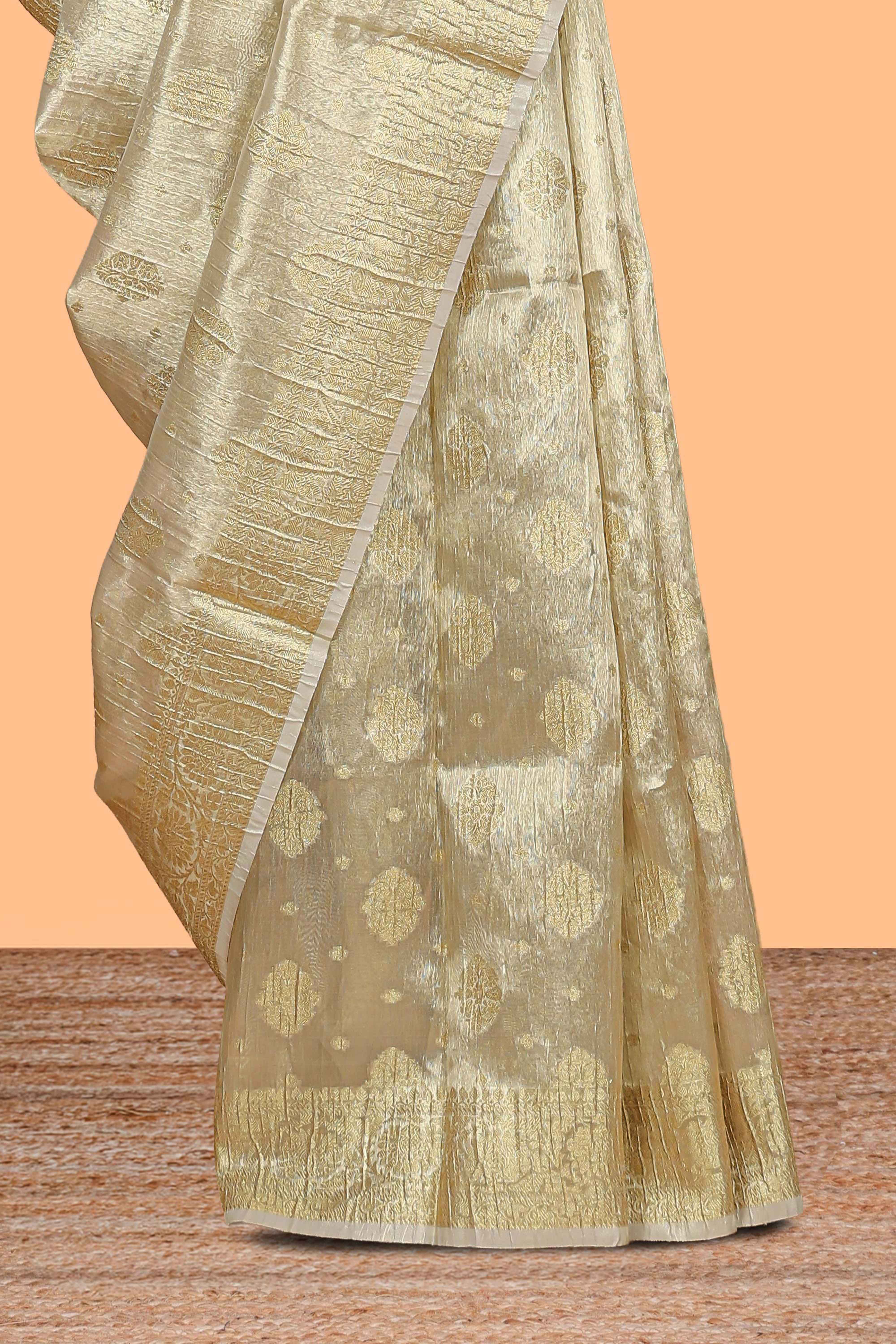 Gold color zari butta design art tissue saree with self zari border and Matching blouse