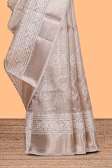 Almond beige Floral vine and ornamental motifs art tissue saree with self zari border and Matching blouse
