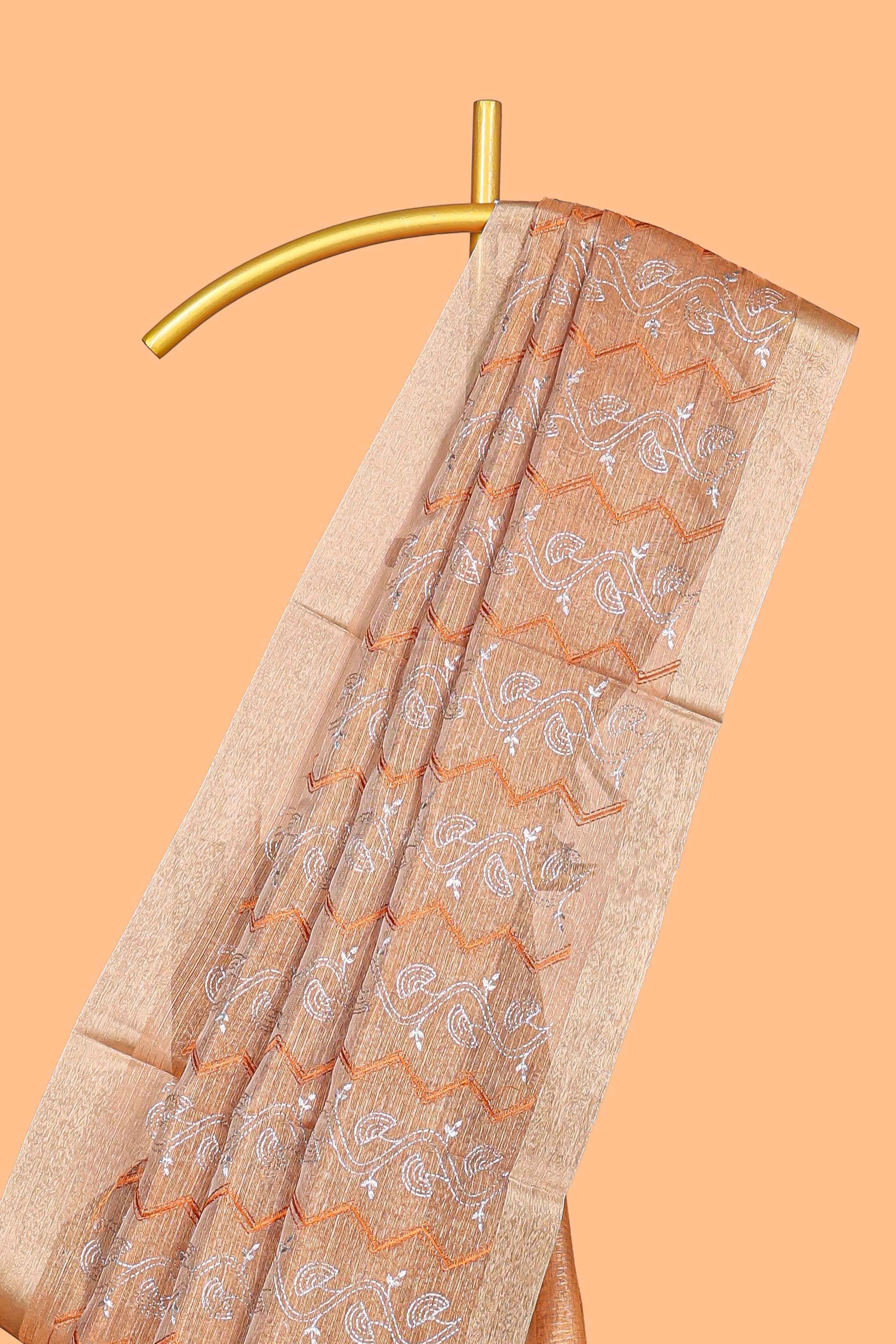Copper geometric and floral motifs art tissue saree with self zari border and contrastr blouse