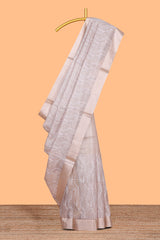 Pearl Ivory flowing leaf and wavy vine pattern art tissue saree with self zari border and contrastr blouse