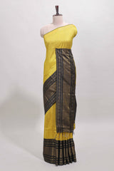 Yellow checked tussar saree with contrast black zari border and checked blouse