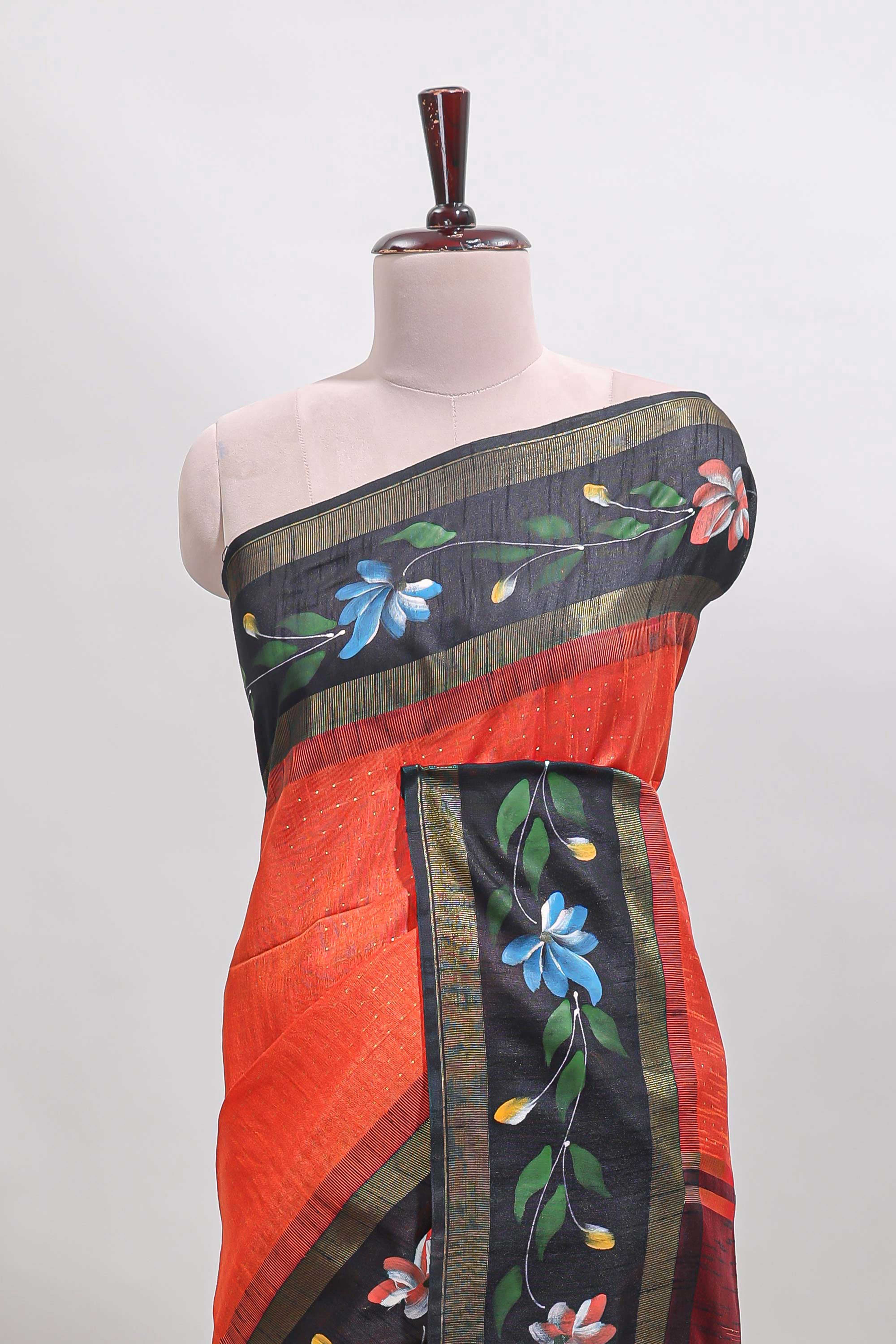 Orange checked semi tussar saree with contrast floral vine border and blouse