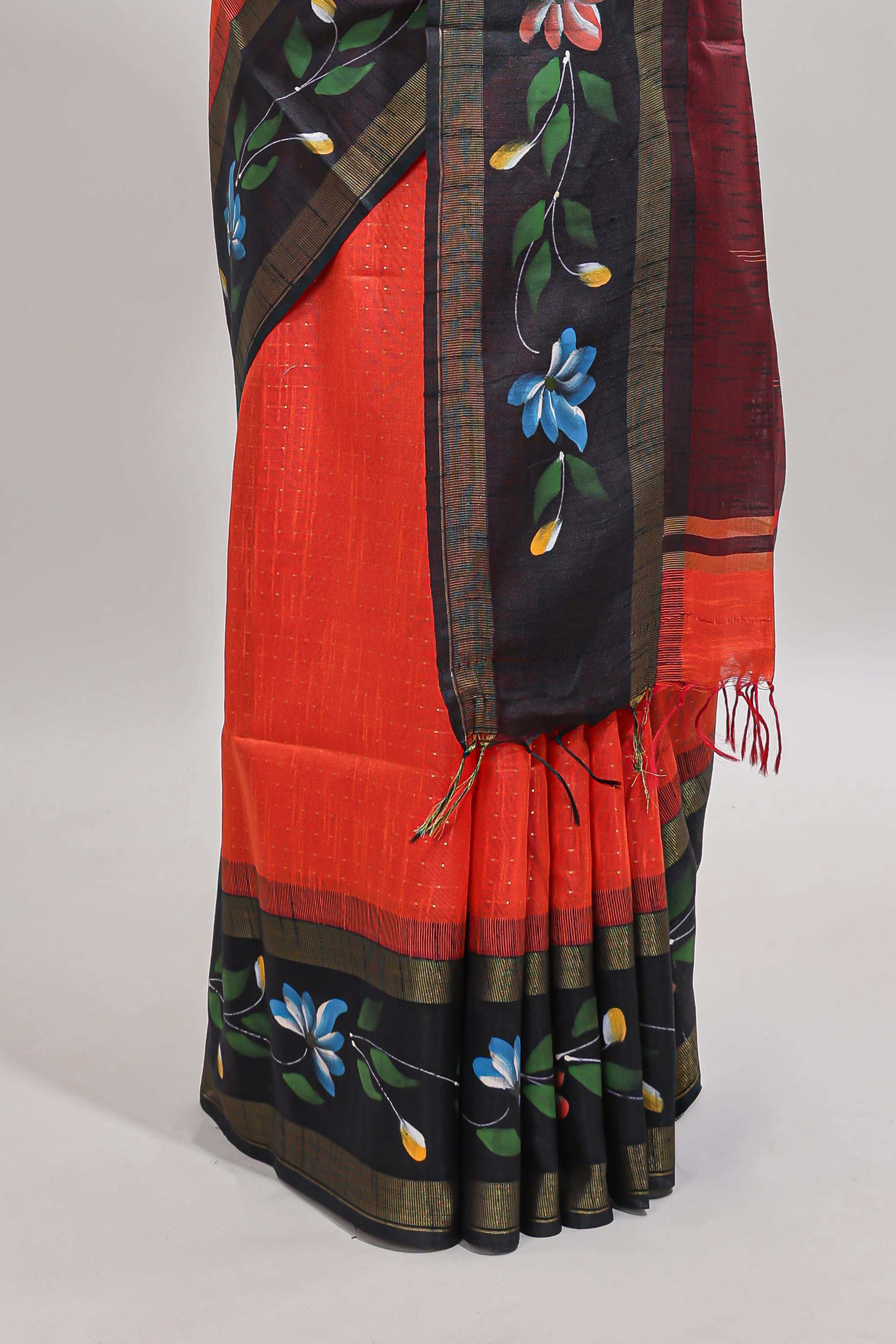 Orange checked semi tussar saree with contrast floral vine border and blouse