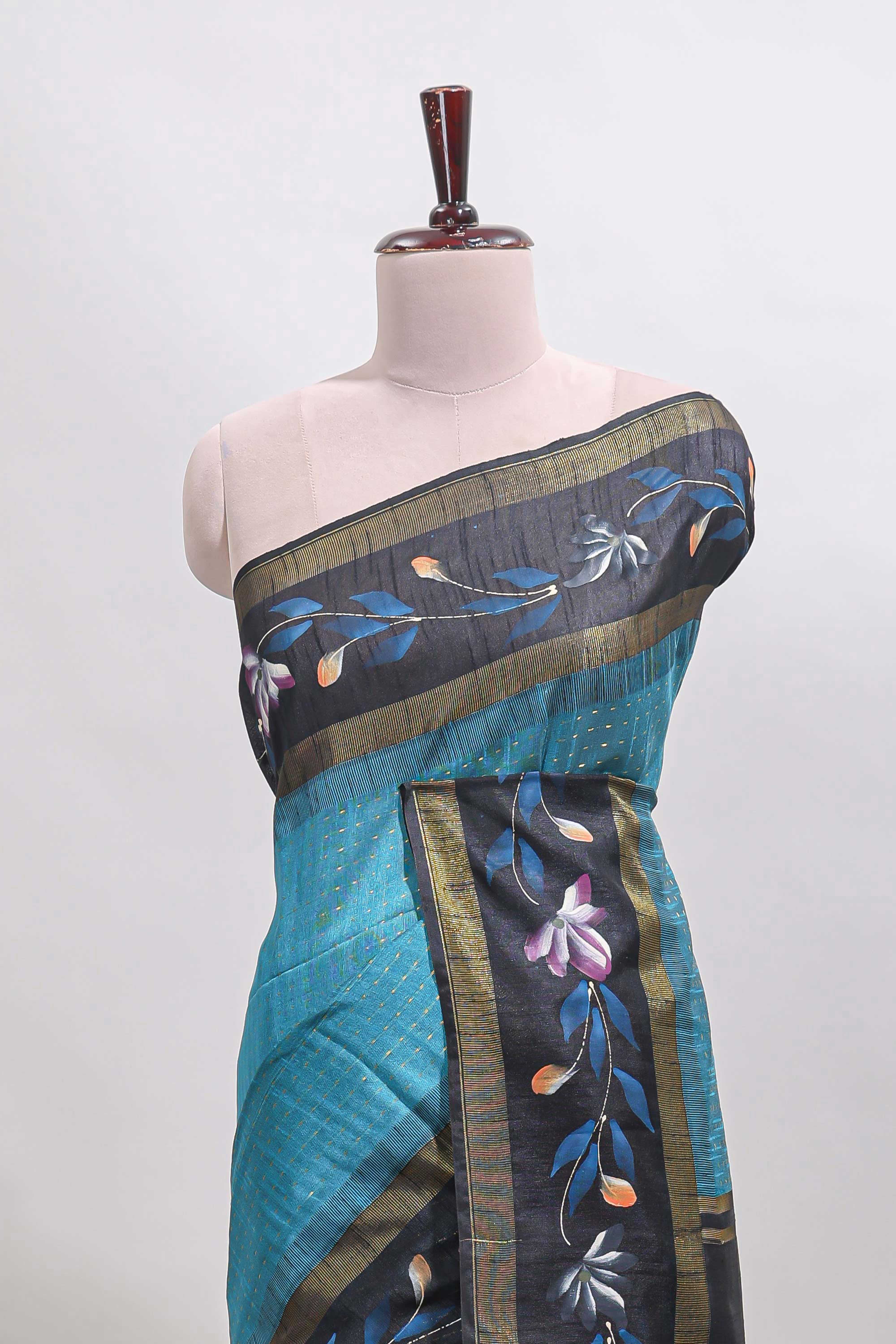 Teal blue checked semi tussar saree with contrast floral vine border and blouse