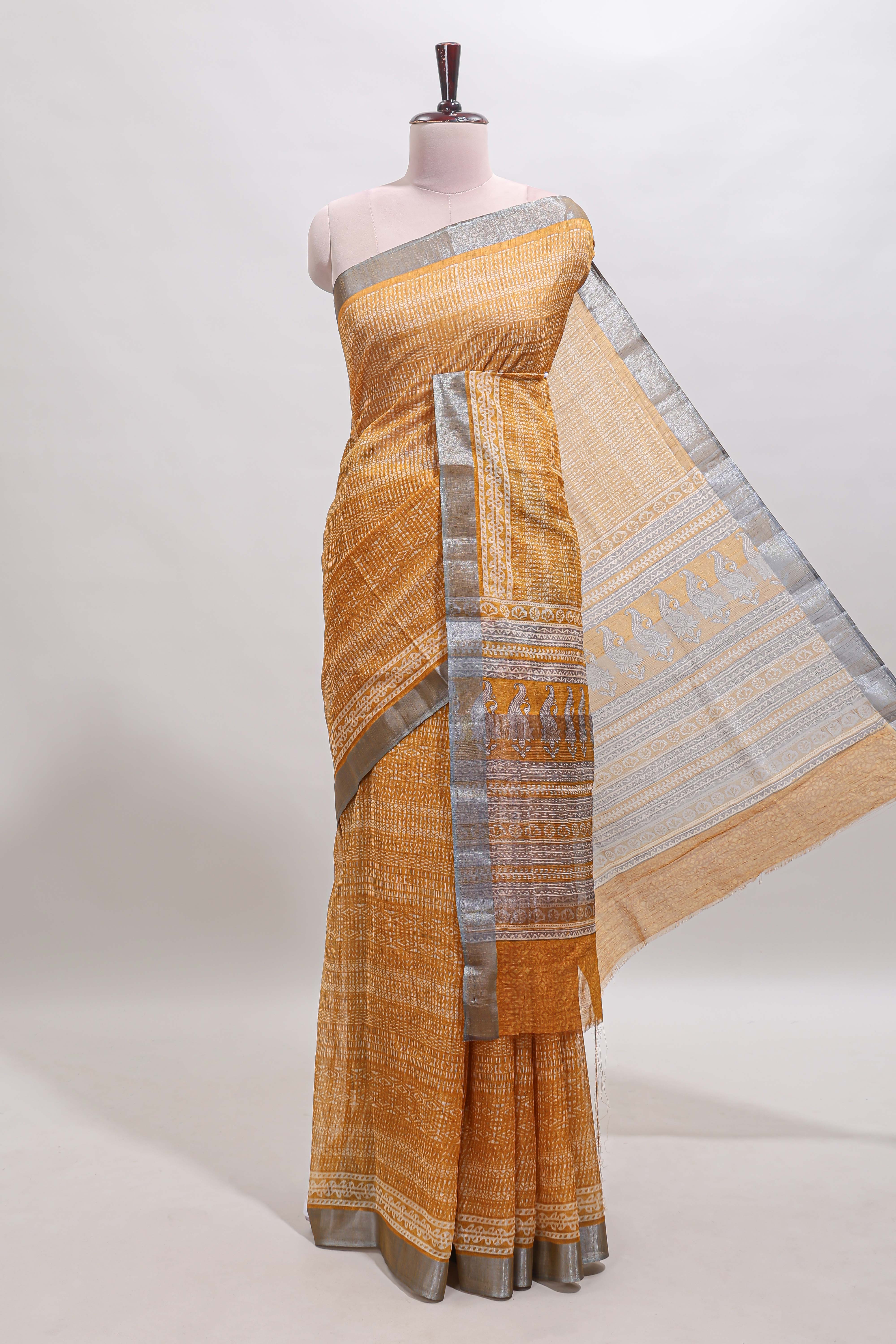 Mustard geometric design semi tussar saree with contrast border and matching blouse