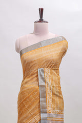 Mustard geometric design semi tussar saree with contrast border and matching blouse