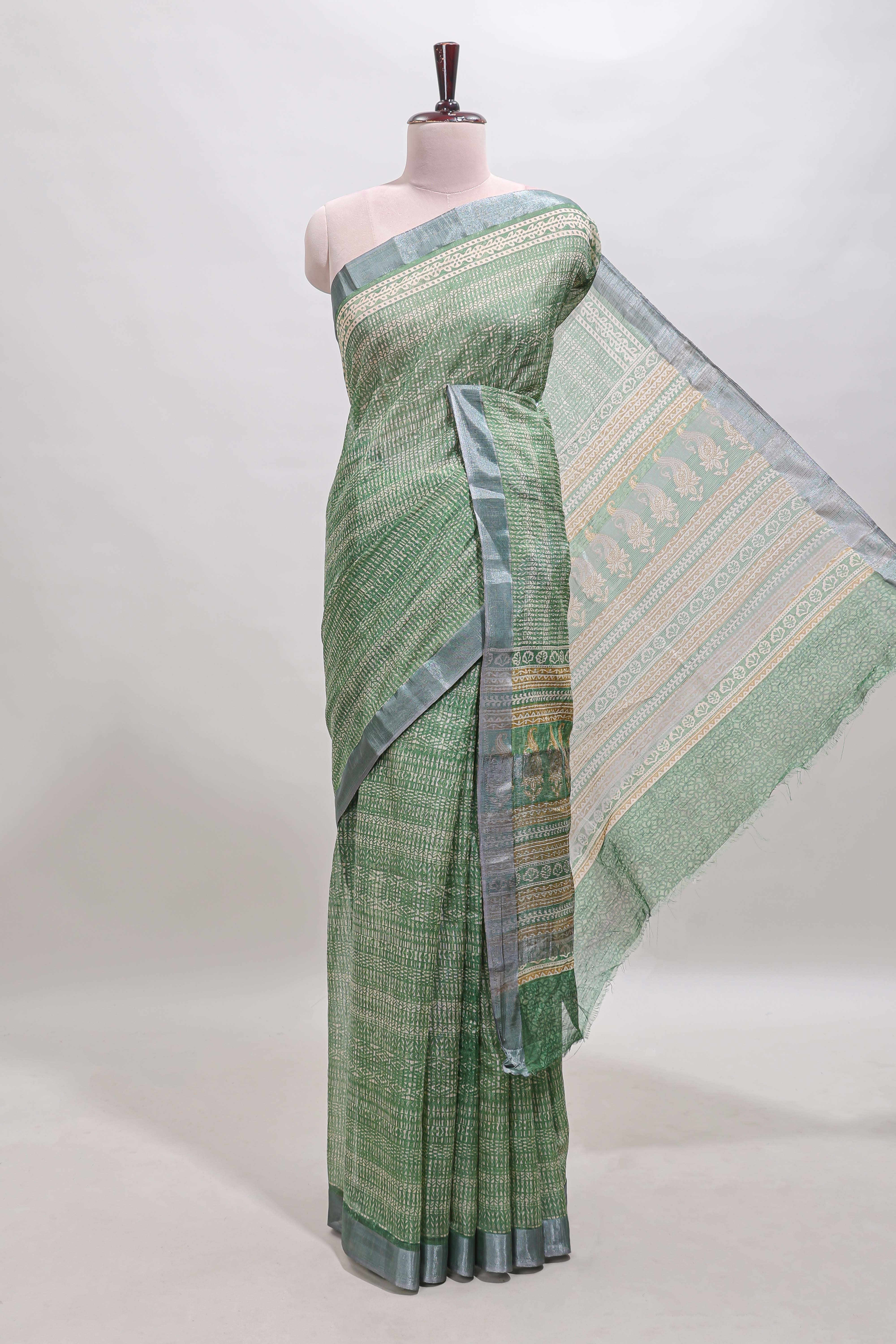 Green geometric design semi tussar saree with contrast border and matching blouse