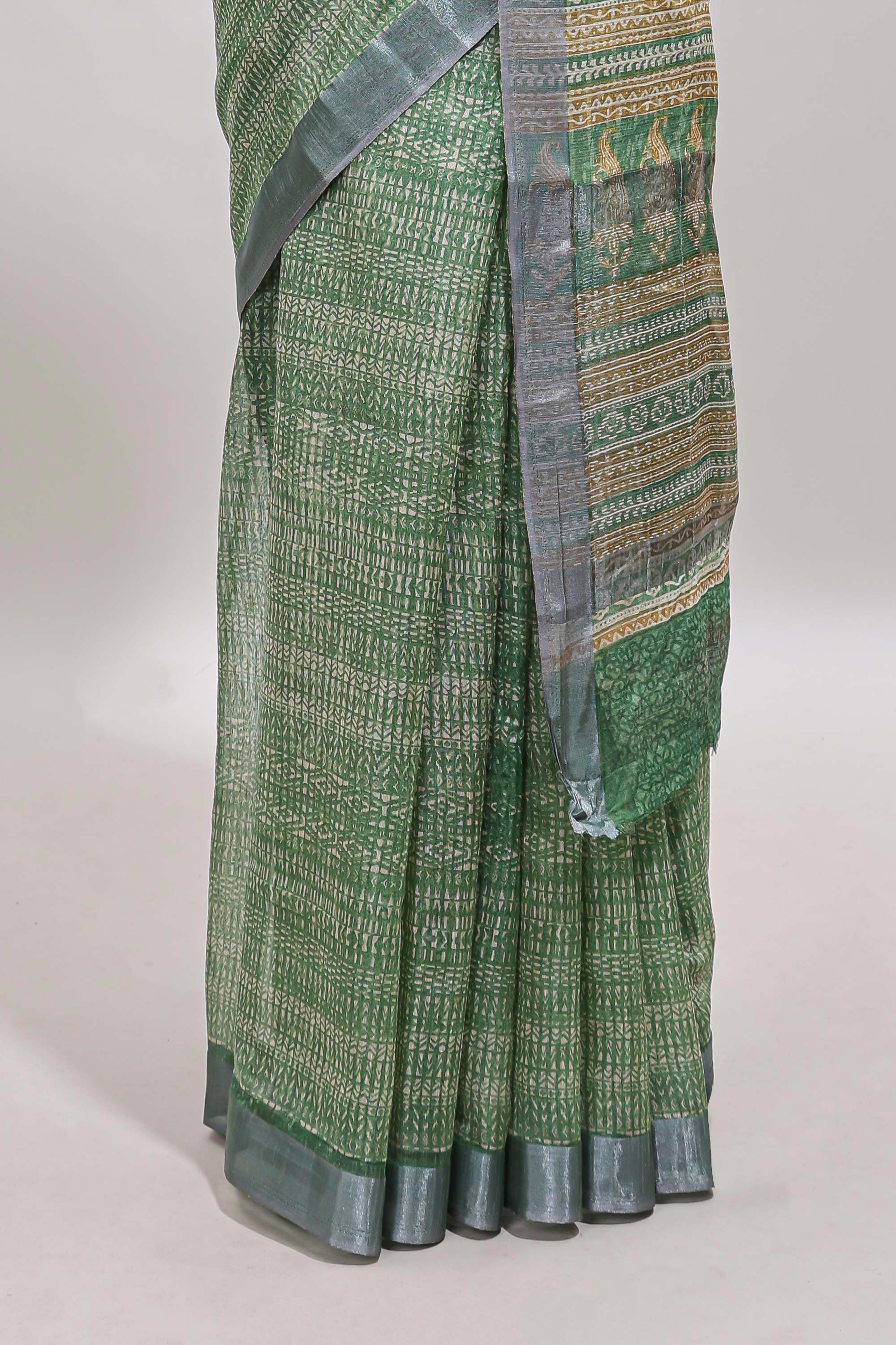 Green geometric design semi tussar saree with contrast border and matching blouse