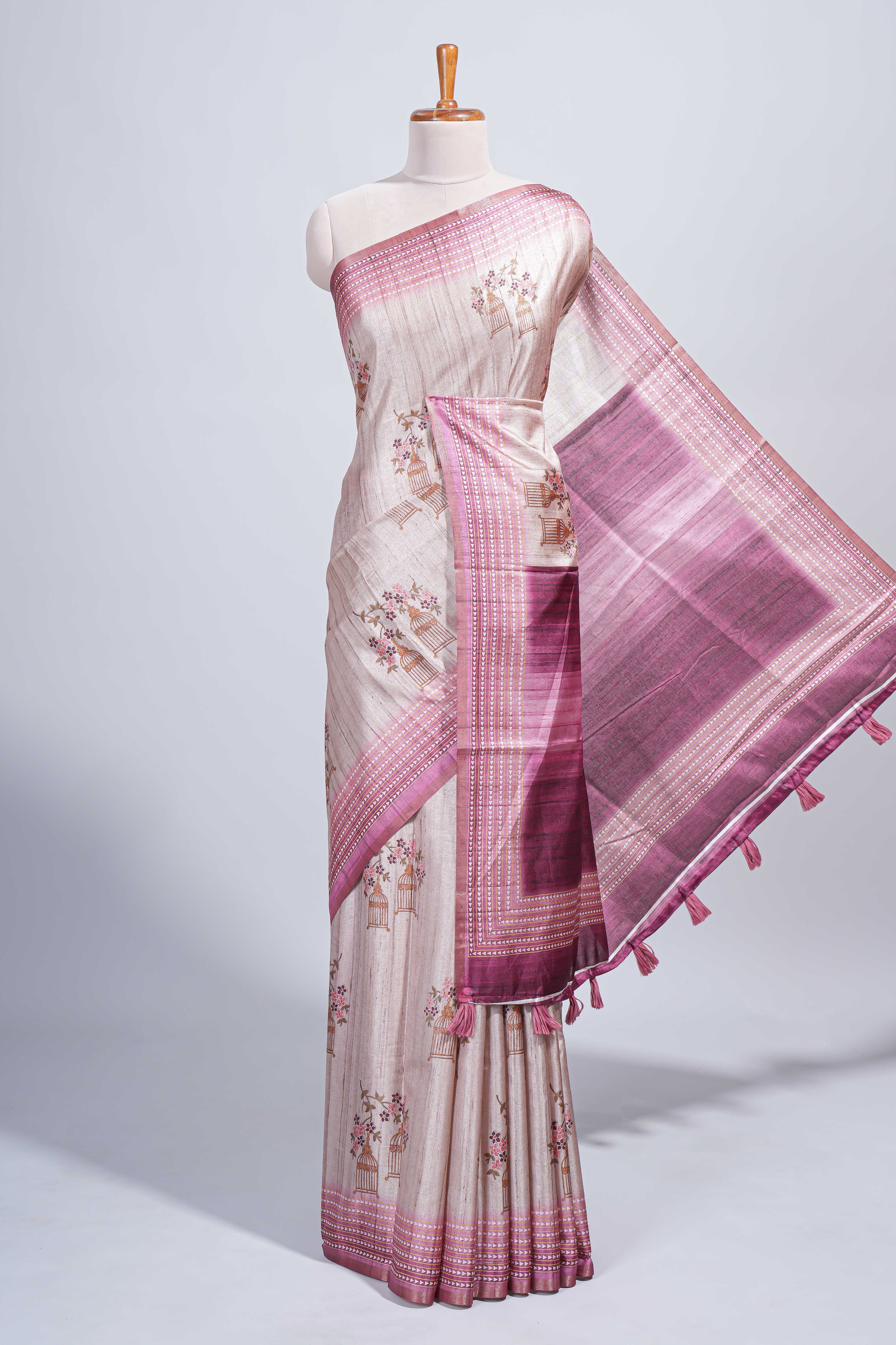 Beige floral & cage print motifs tussar saree with contrast border and blouse