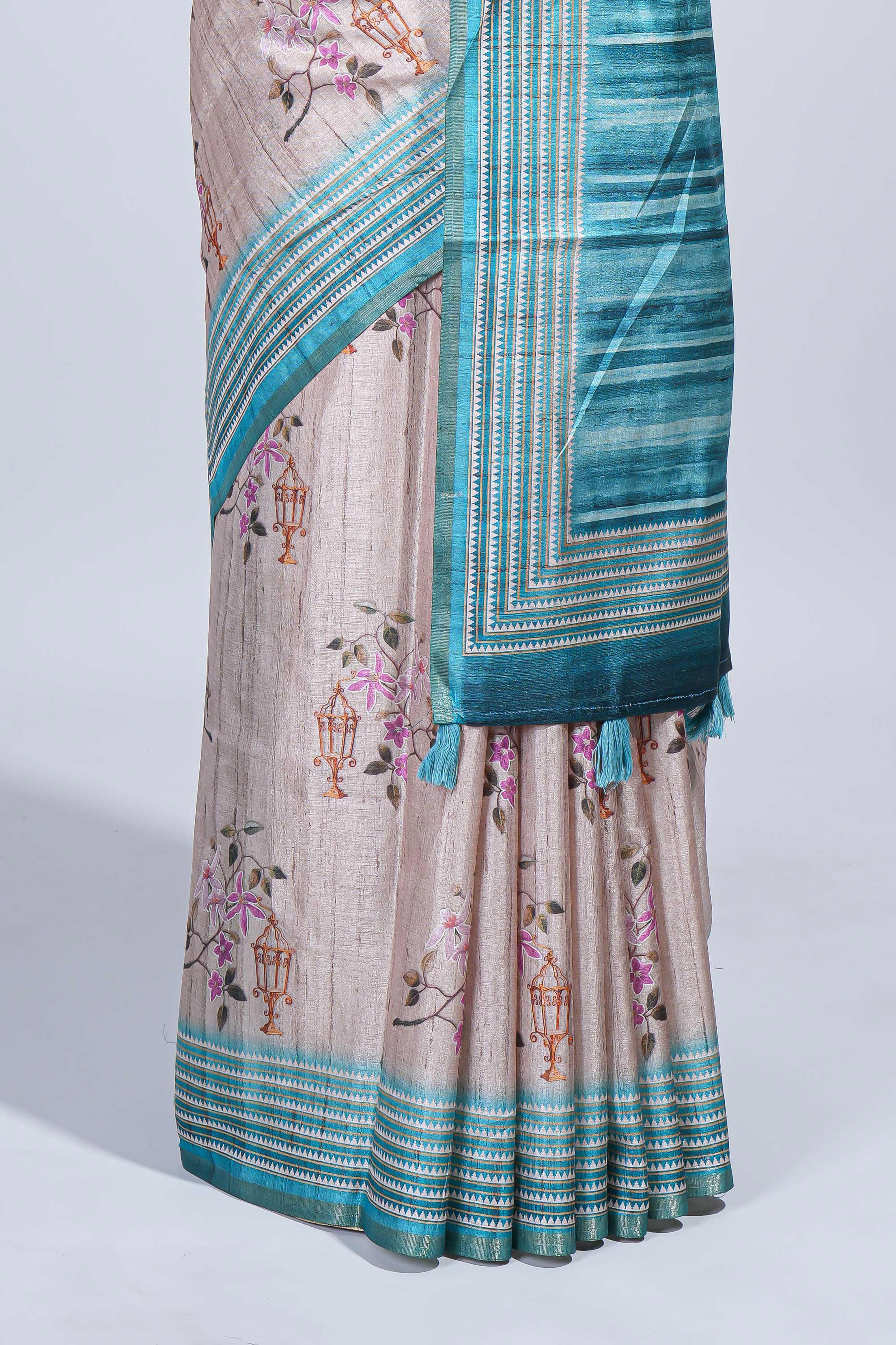 Beige floral & cage print motifs tussar saree with contrast border and blouse