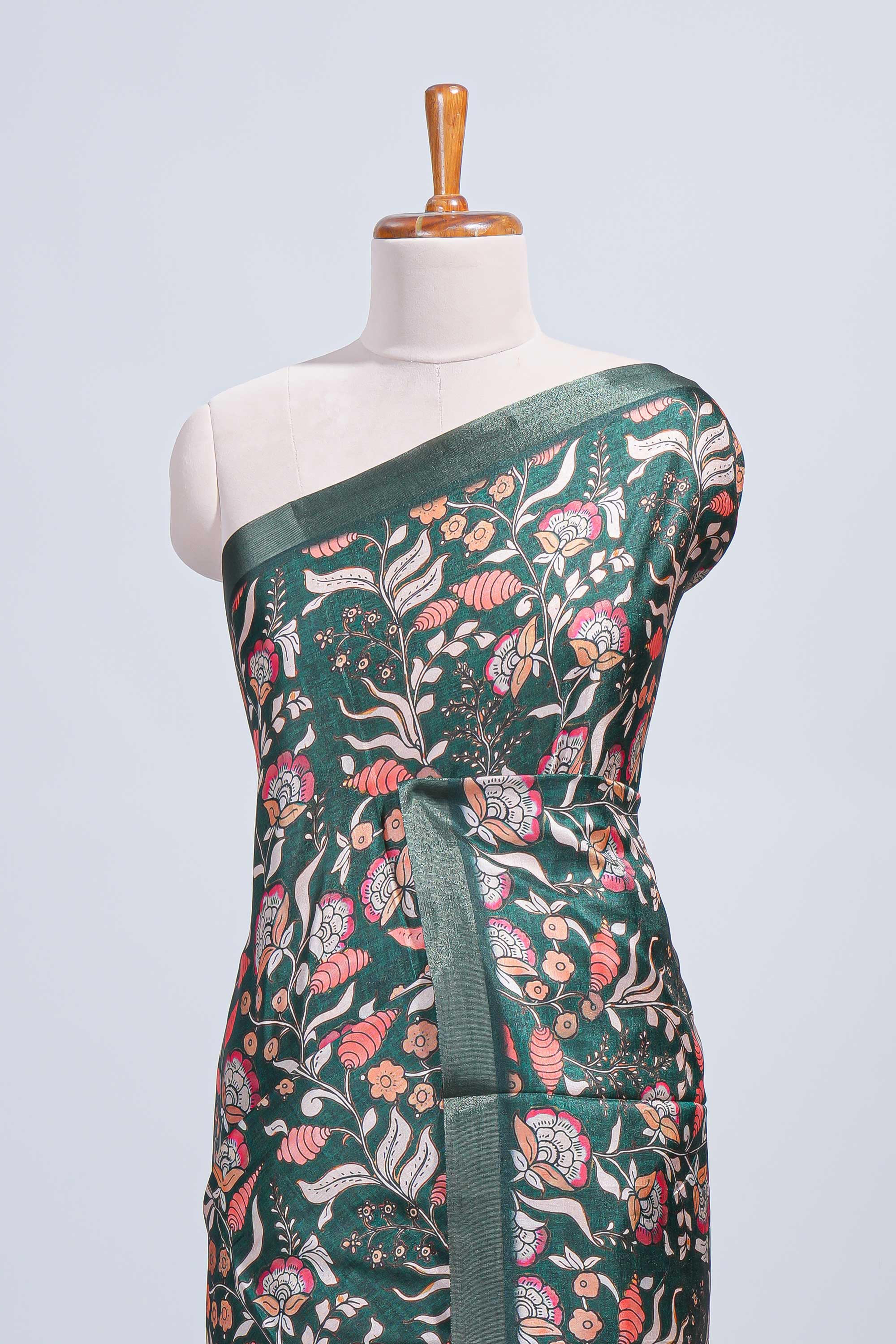 Green floral design tussar saree with self zari border and matching blouse