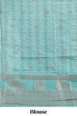 Turquoise green pichwai print tussar saree with contrast zari border and matching blouse