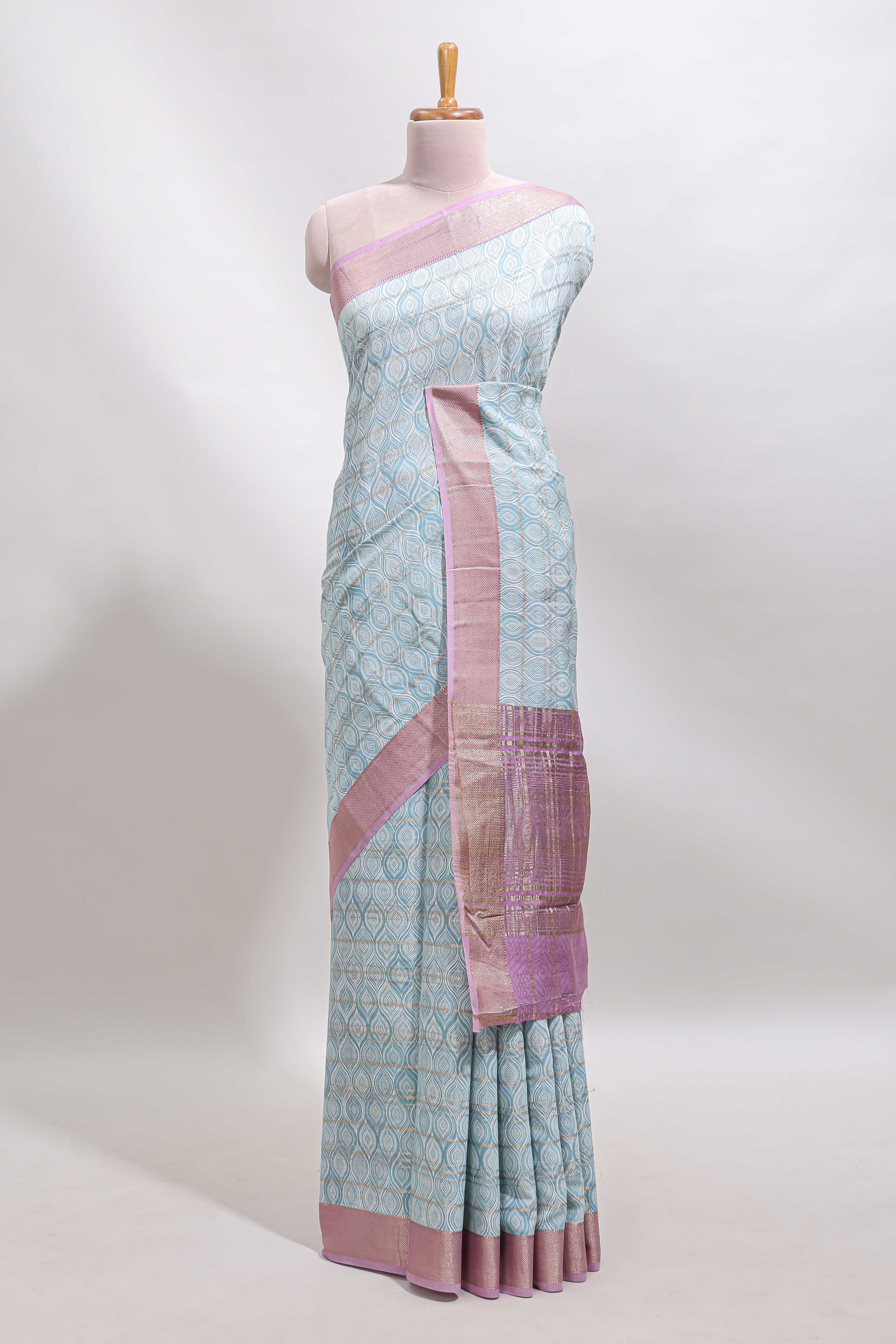 Blue geometric design tussar saree with contrast zari border and striped blouse