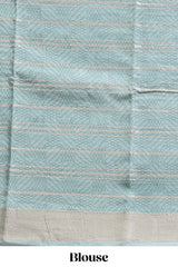 Peach geometric design tussar saree with contrast zari border and striped blouse