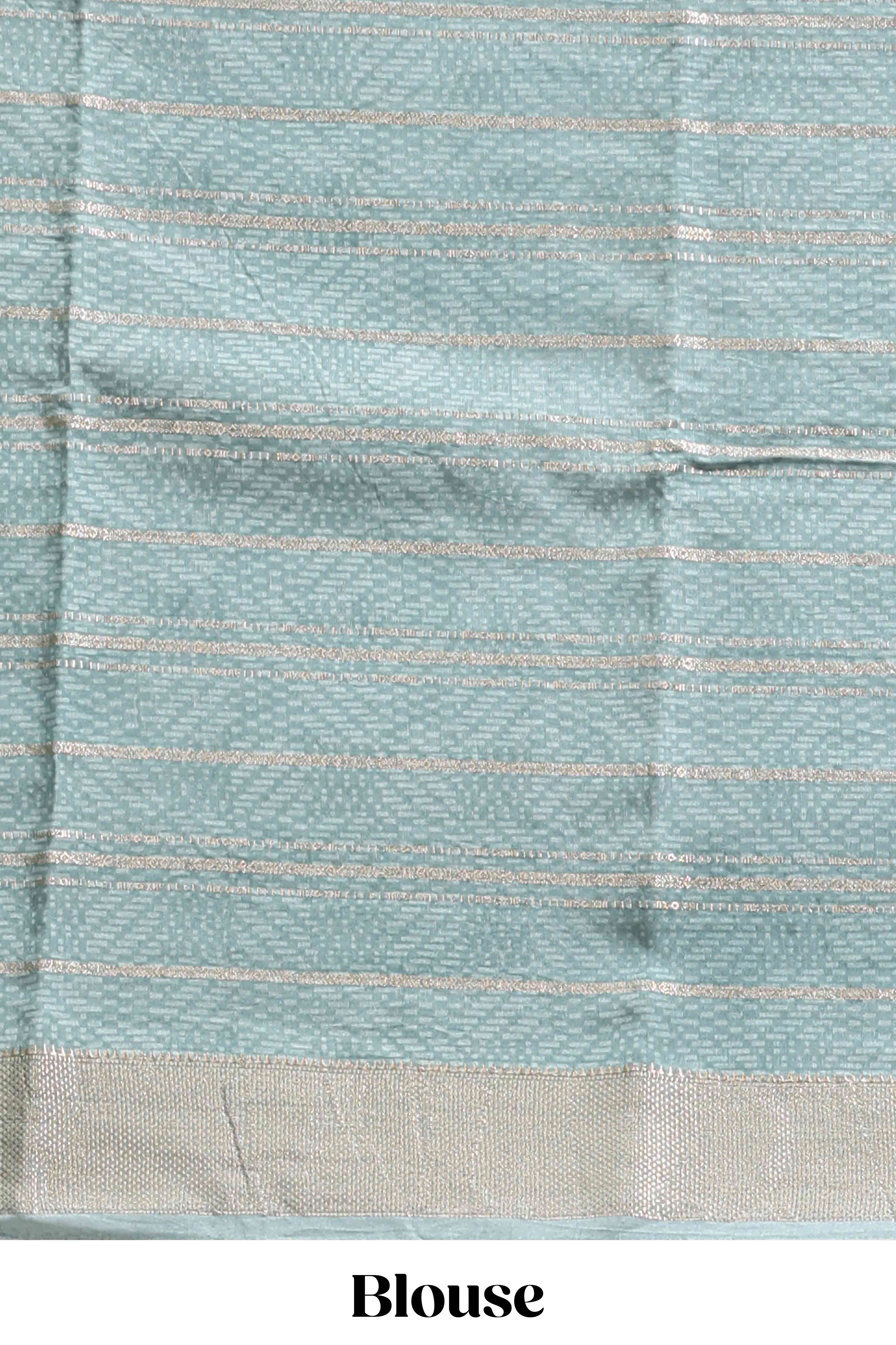 Peach geometric design tussar saree with contrast zari border and striped blouse