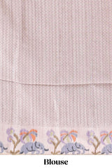 Grey checked tussar saree with contrast ikkat style elephant and floral print border and printed pallu
