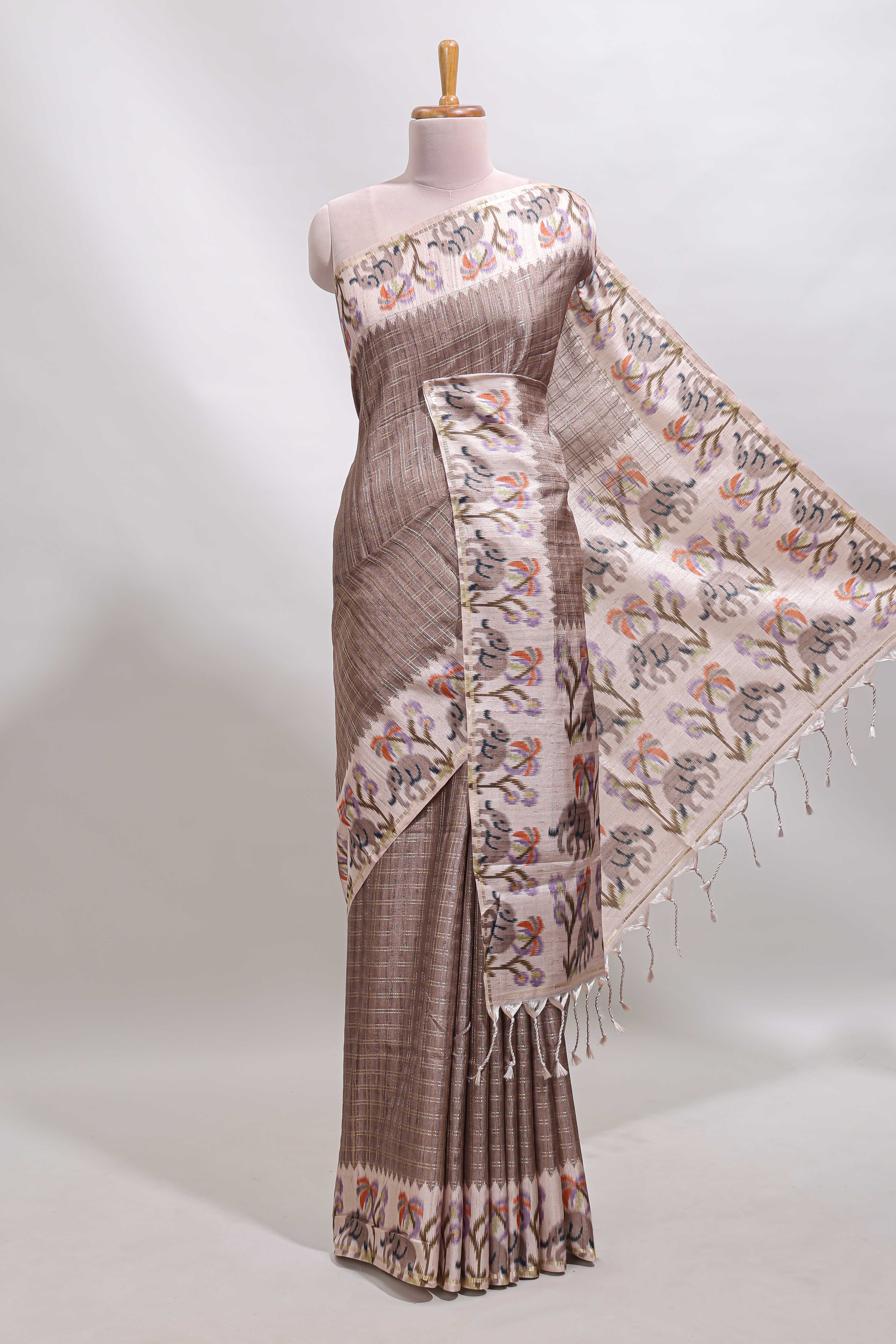 Beaver brown checked tussar saree with contrast ikkat style elephant and floral print border and printed pallu