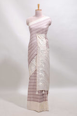 Cream striped tussar saree with contrast border and matching printed blouse