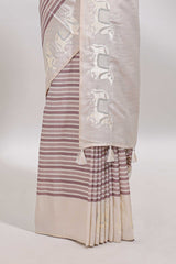 Cream striped tussar saree with contrast border and matching printed blouse