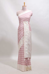 Cream striped tussar saree with contrast border and matching printed blouse