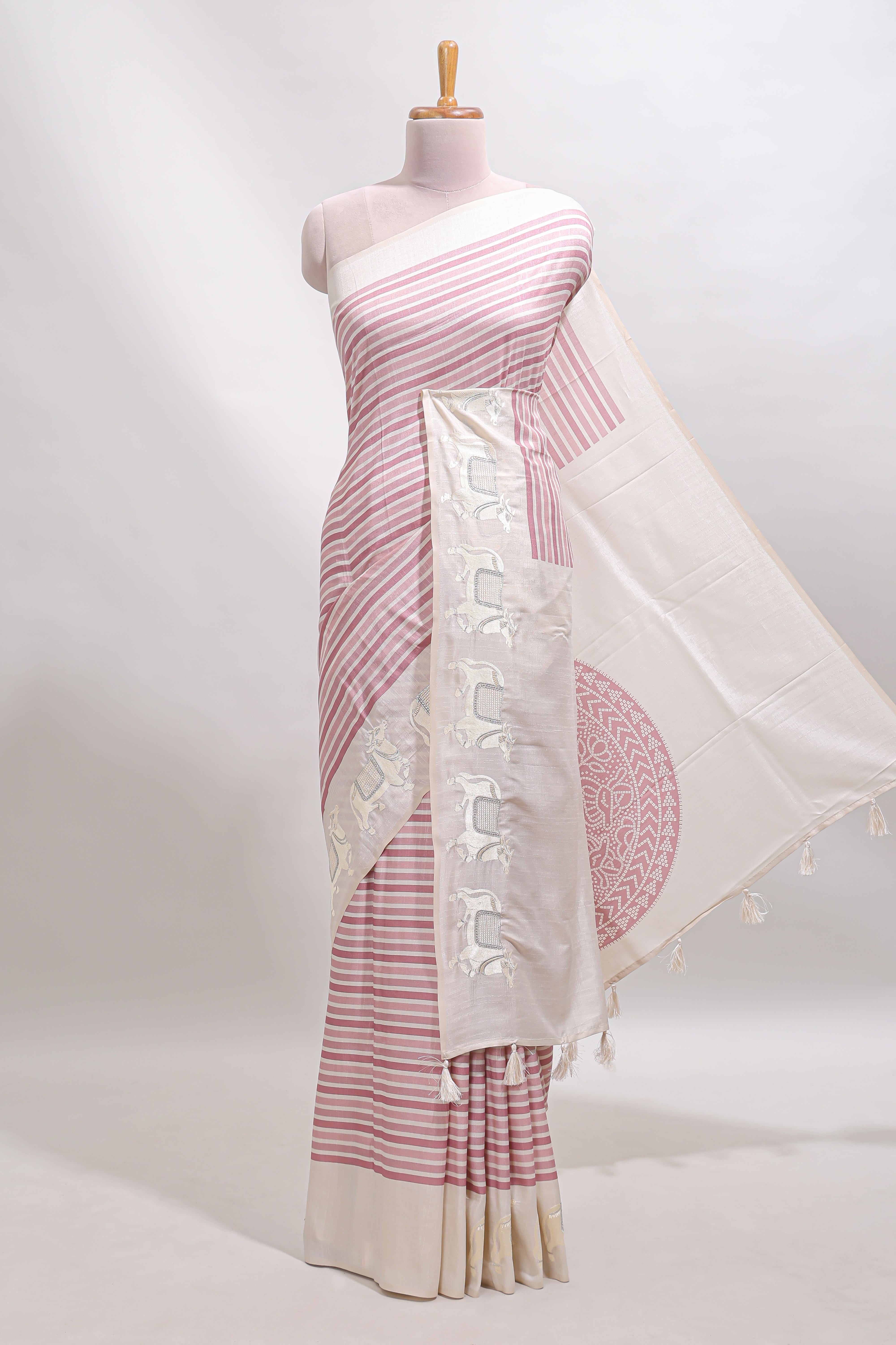 Cream striped tussar saree with contrast border and matching printed blouse