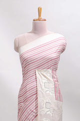 Cream striped tussar saree with contrast border and matching printed blouse
