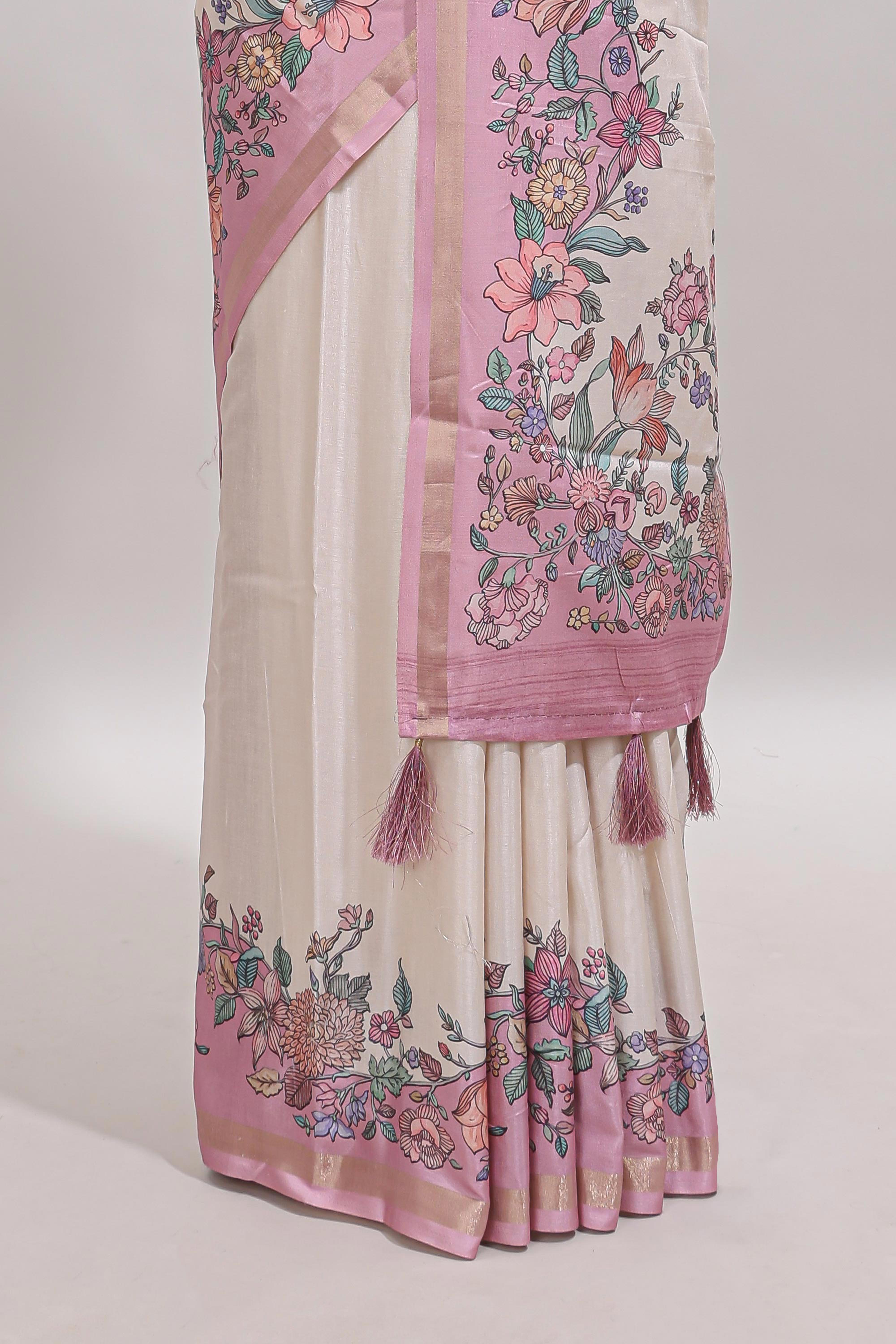 Cream floral design tussar saree with contrast zari border and self pallu
