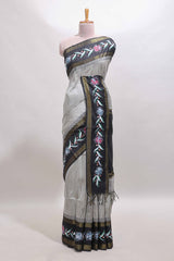Grey zari design tussar saree with contrast floral print border and blouse