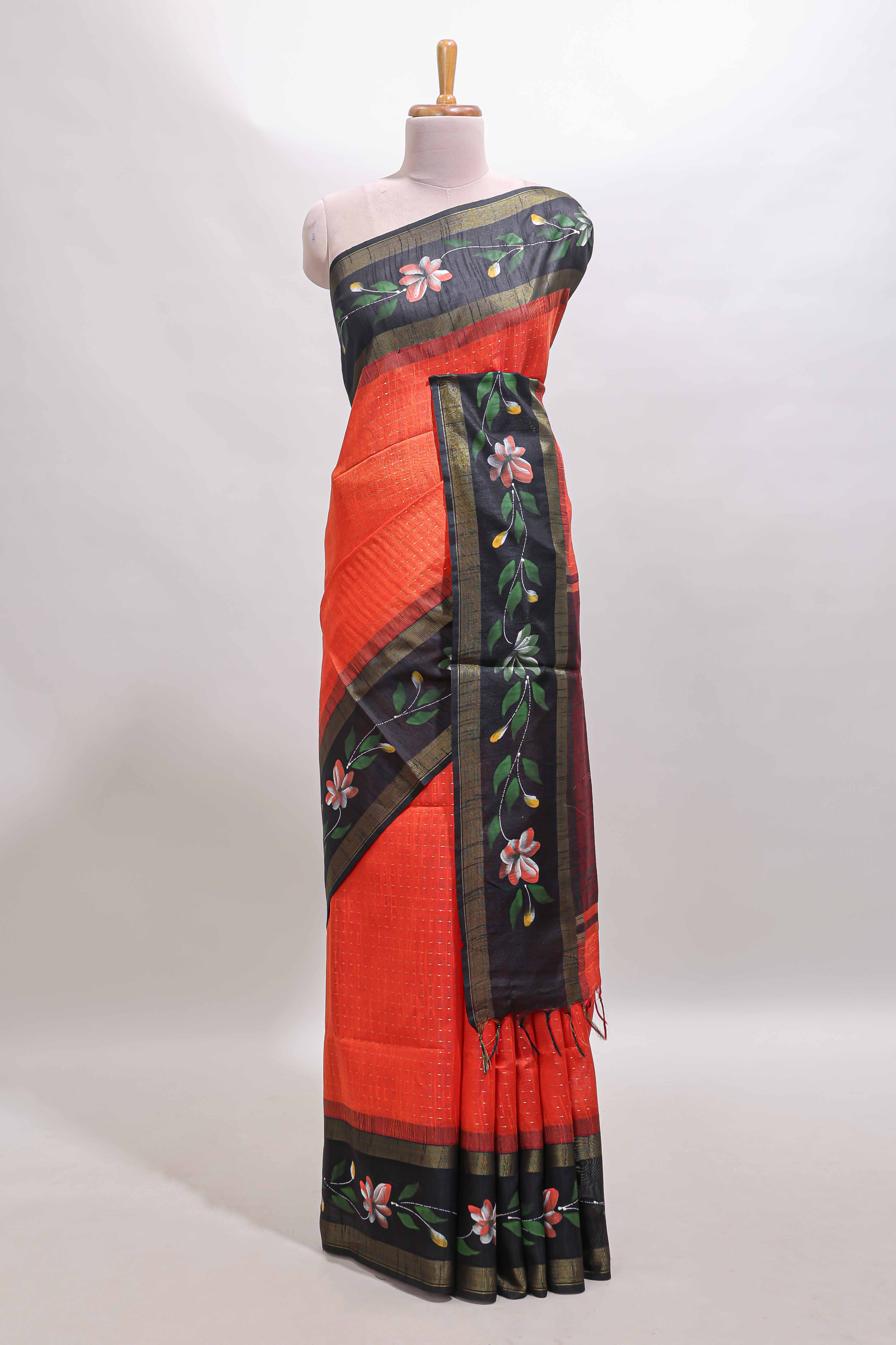 Orange zari design tussar saree with contrast floral print border and blouse