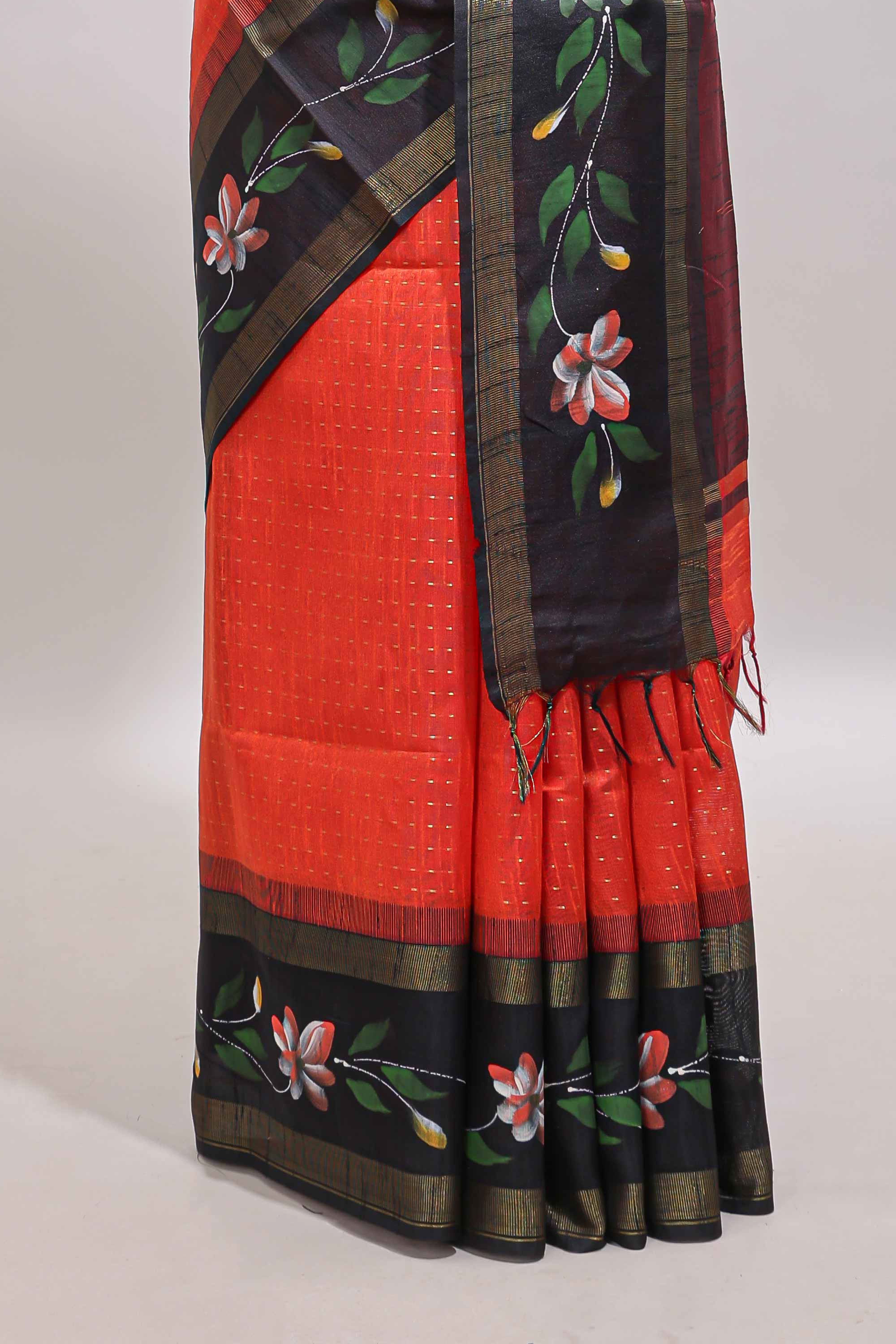 Orange zari design tussar saree with contrast floral print border and blouse