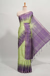 Green checked semi tussar saree with contrast border and striped blouse