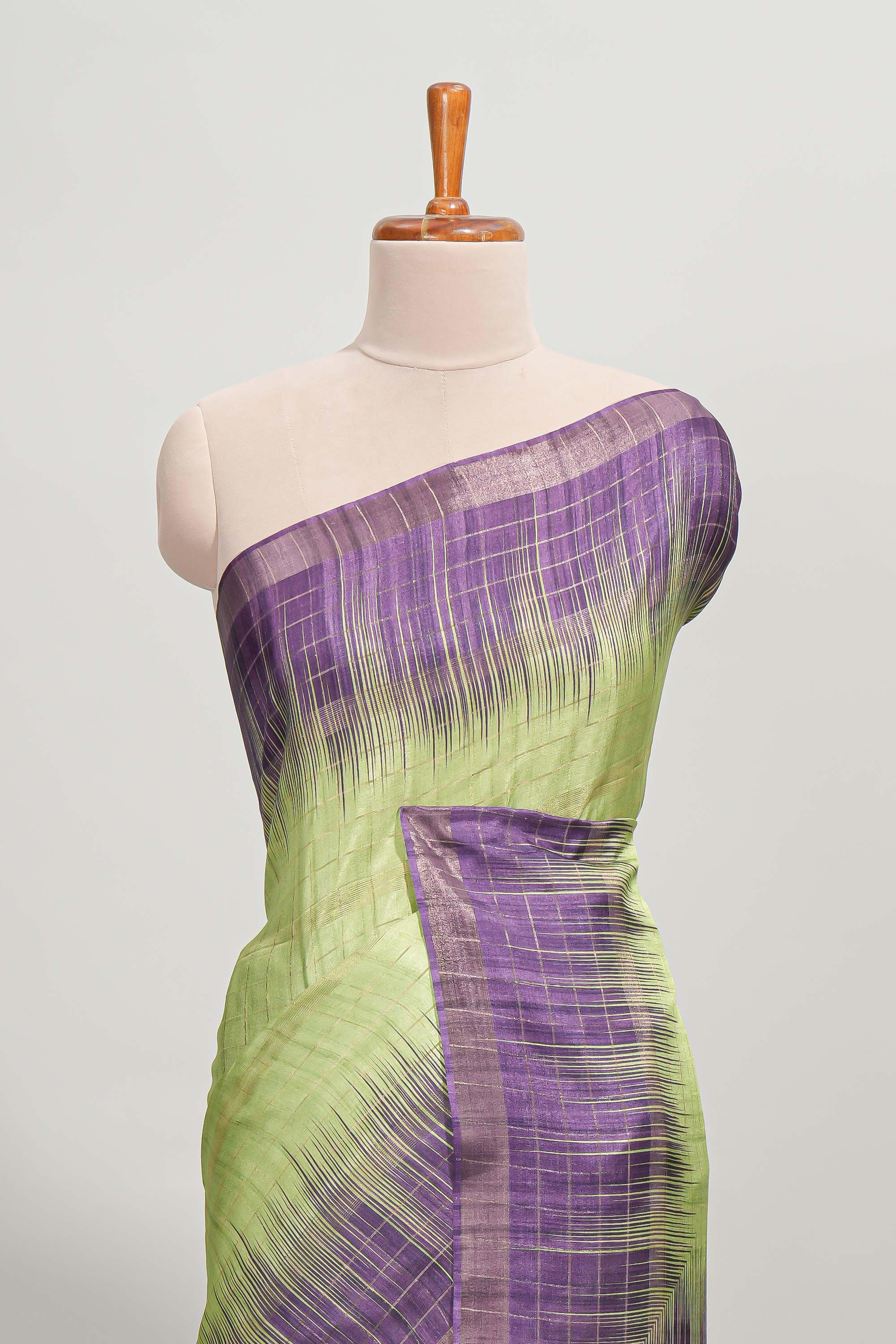 Green checked semi tussar saree with contrast border and striped blouse
