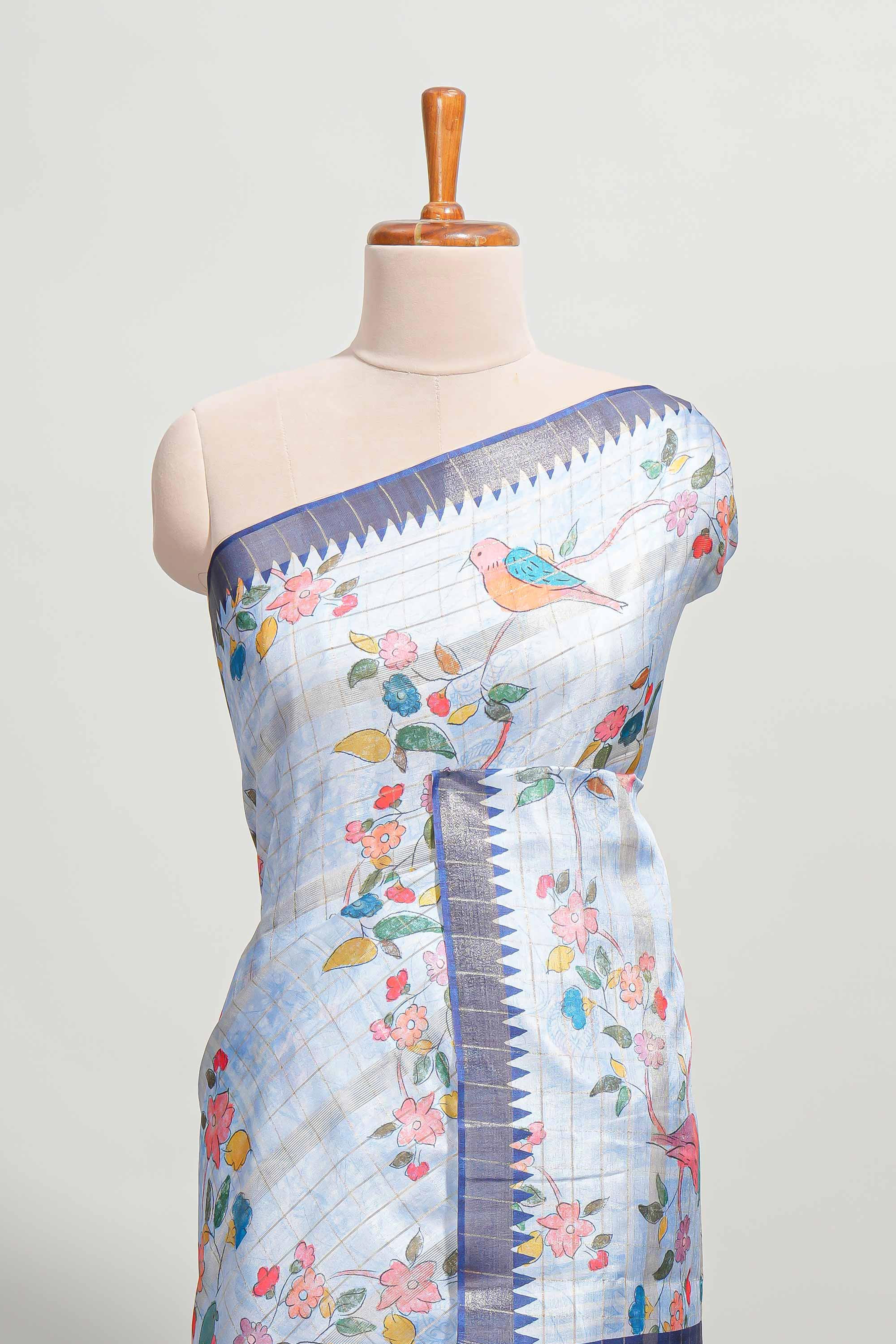 Blue checked birds & floral design semi tussar saree with contrast border and checked blouse