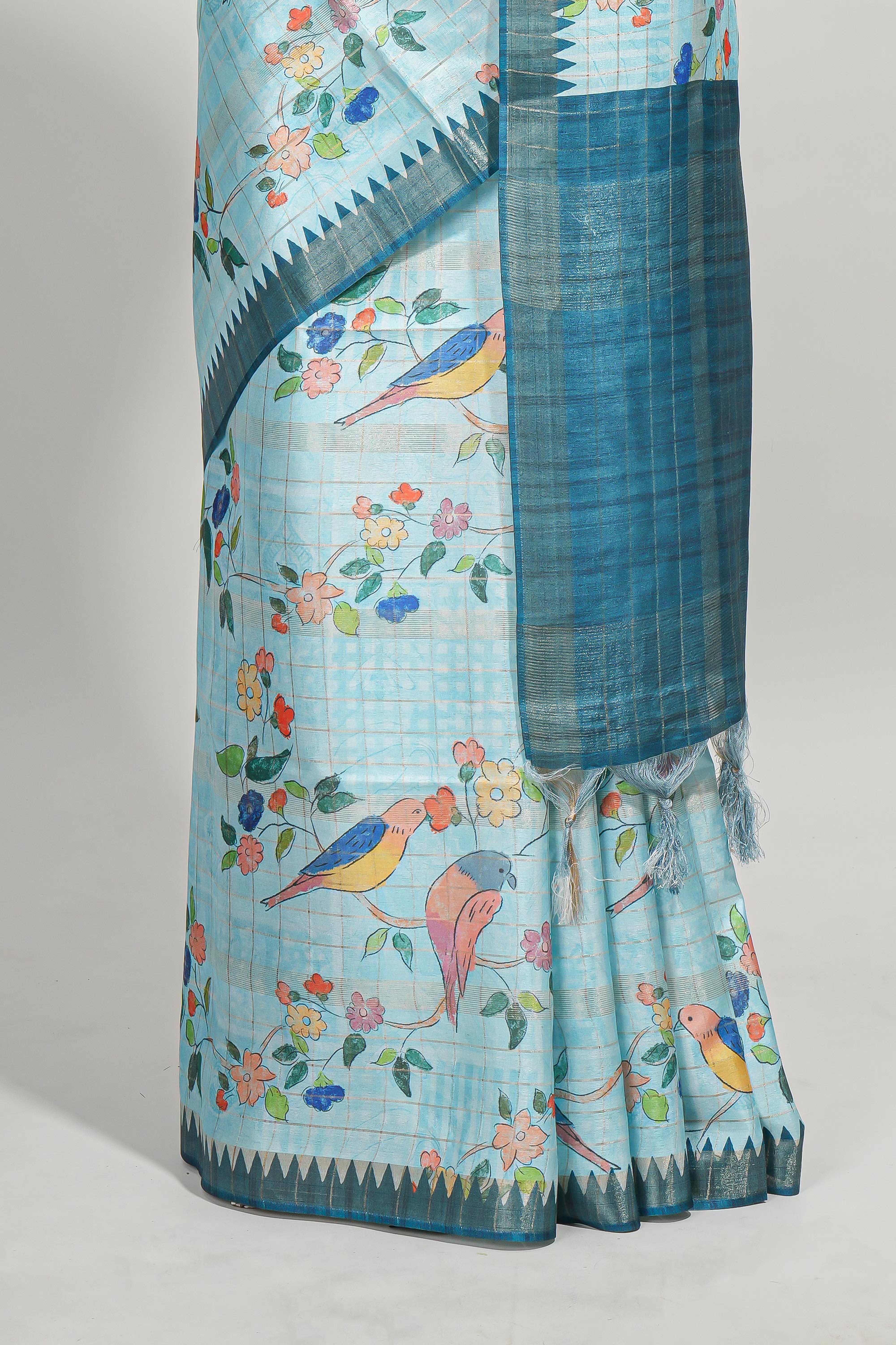 Powder blue checked birds & floral design semi tussar saree with contrast border and checked blouse