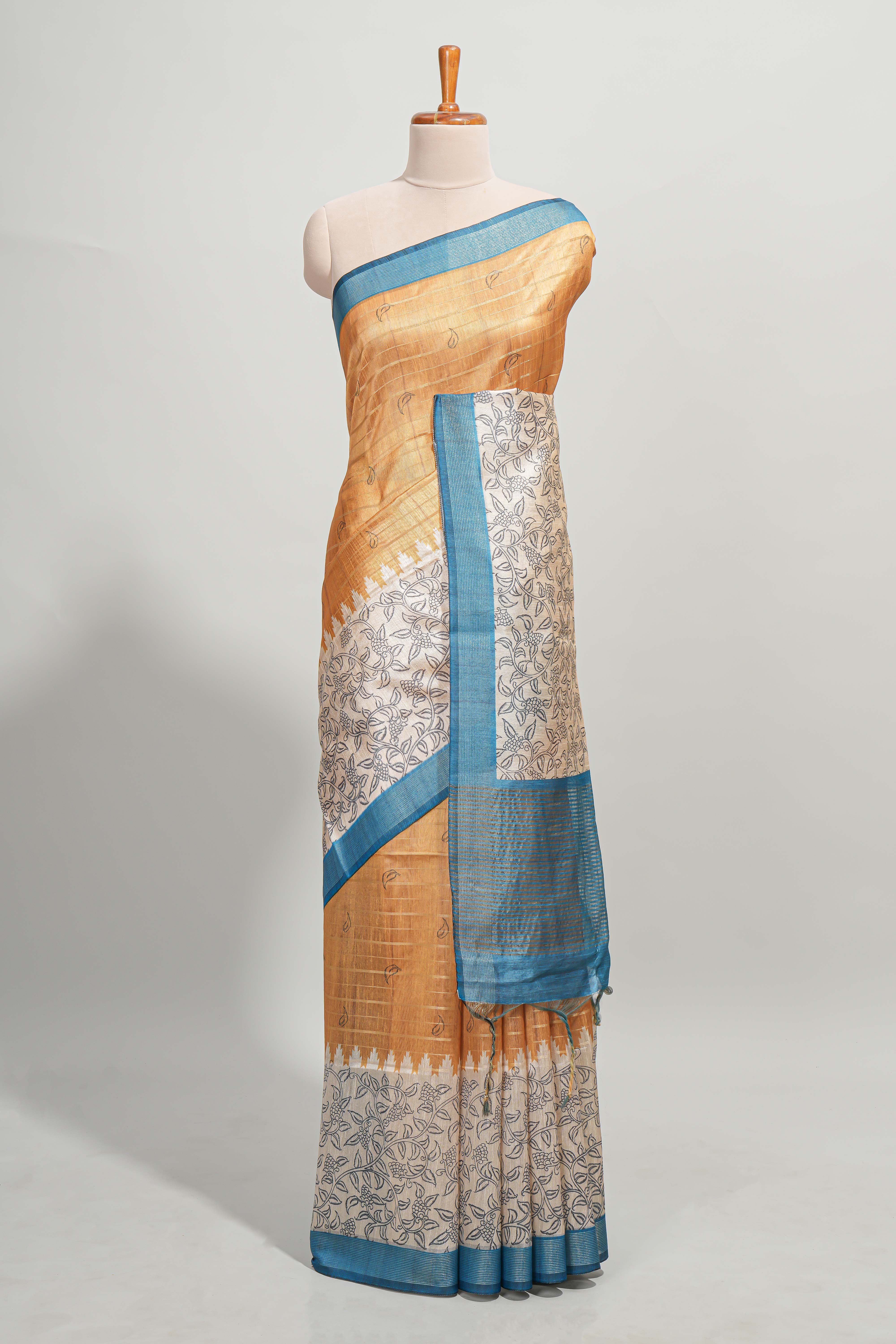 Orange striped floral design semi tussar saree with contrast border and striped blouse