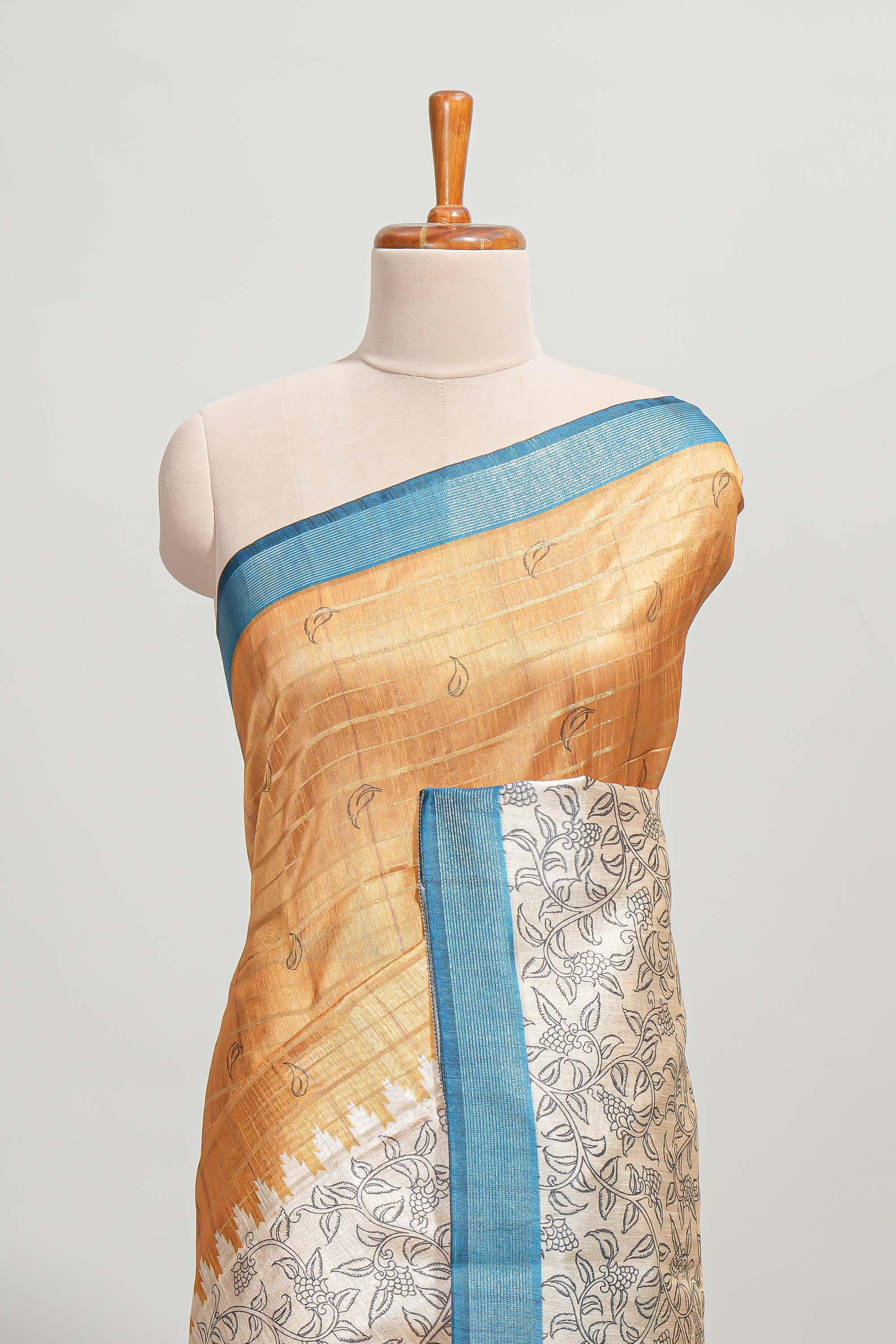 Orange striped floral design semi tussar saree with contrast border and striped blouse