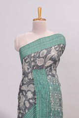 Grey floral design semi tussar saree with contrast green border and printed pallu