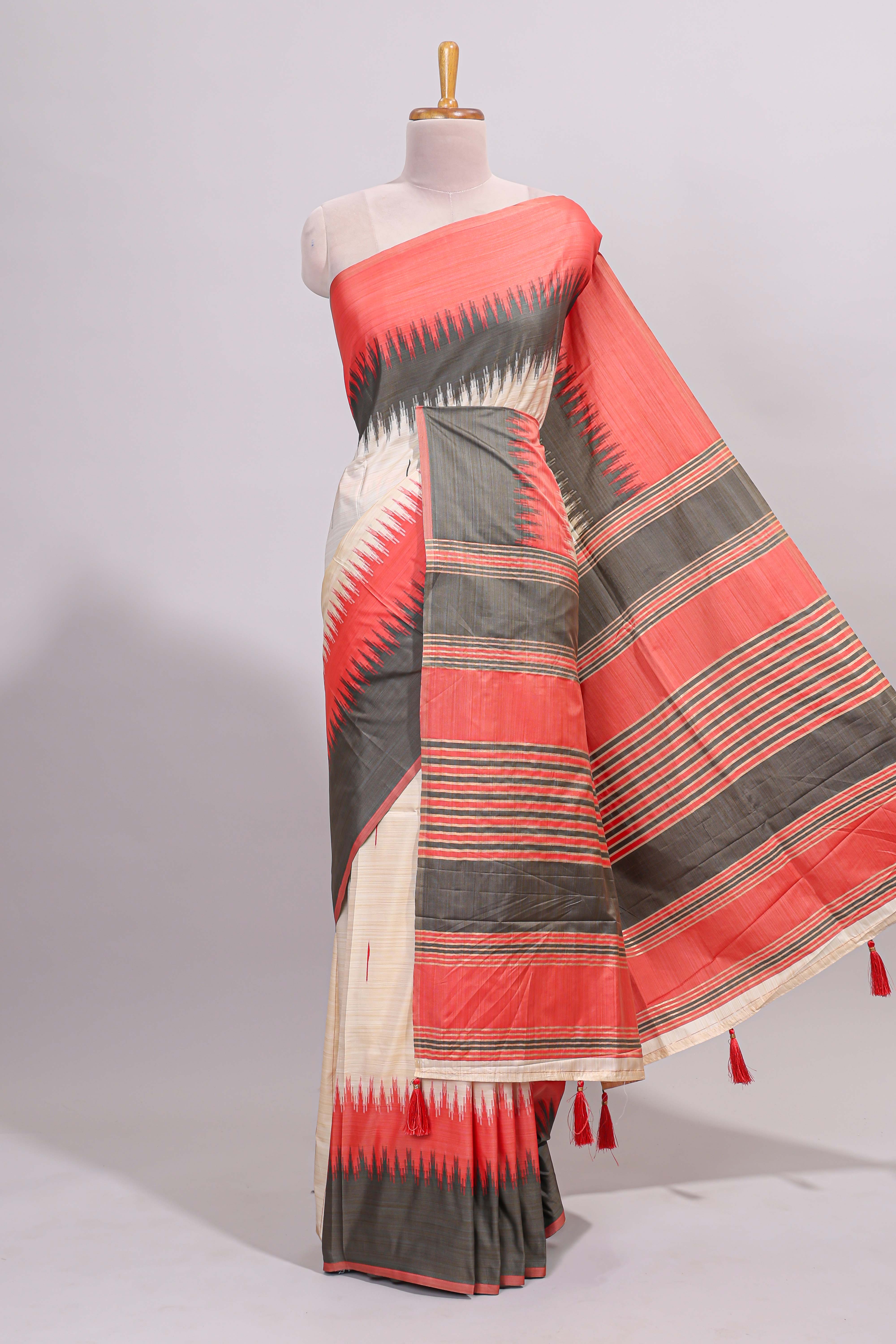 Off white ikkat design semi tussar saree with contrast dual shade border and matching striped blouse