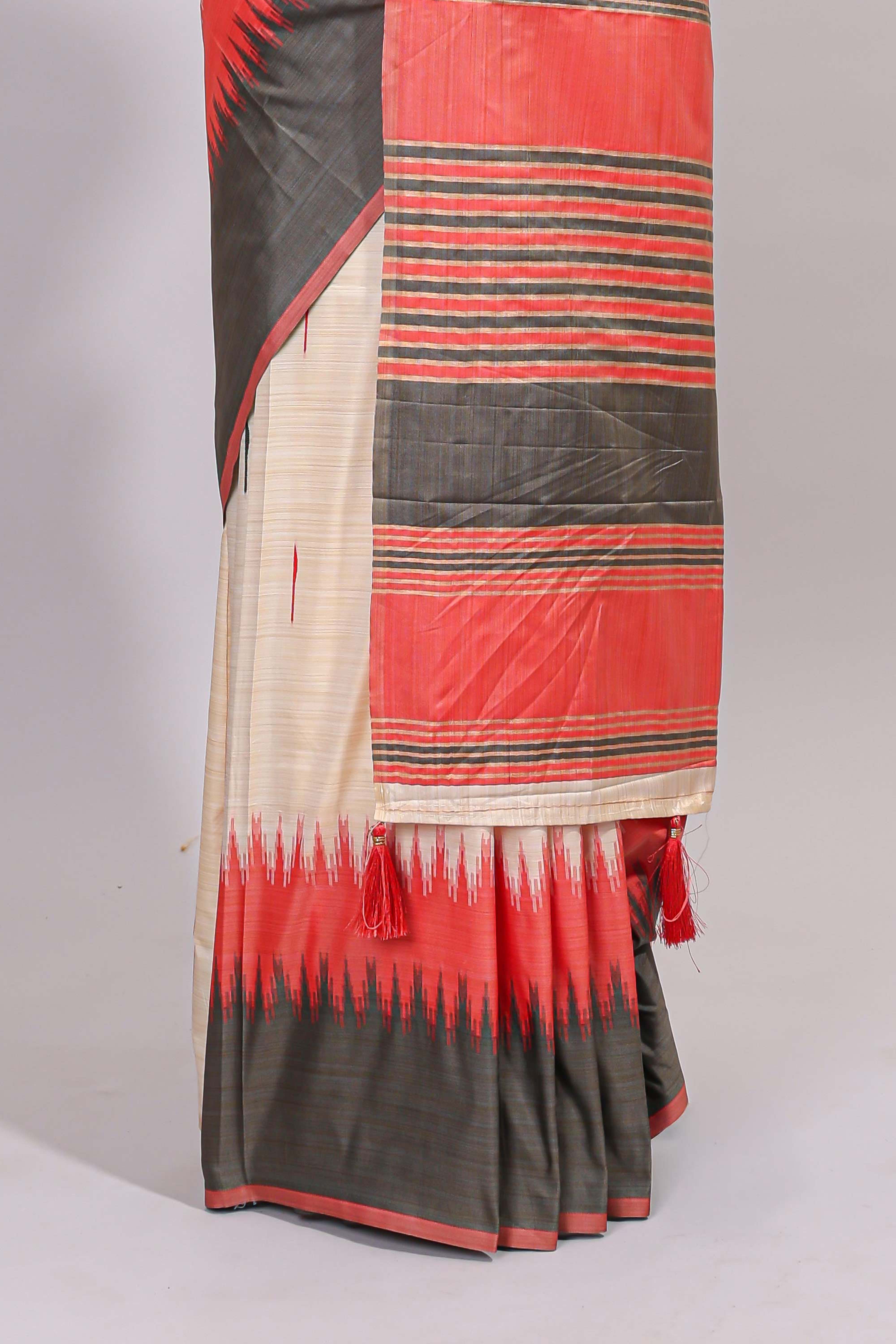 Off white ikkat design semi tussar saree with contrast dual shade border and matching striped blouse