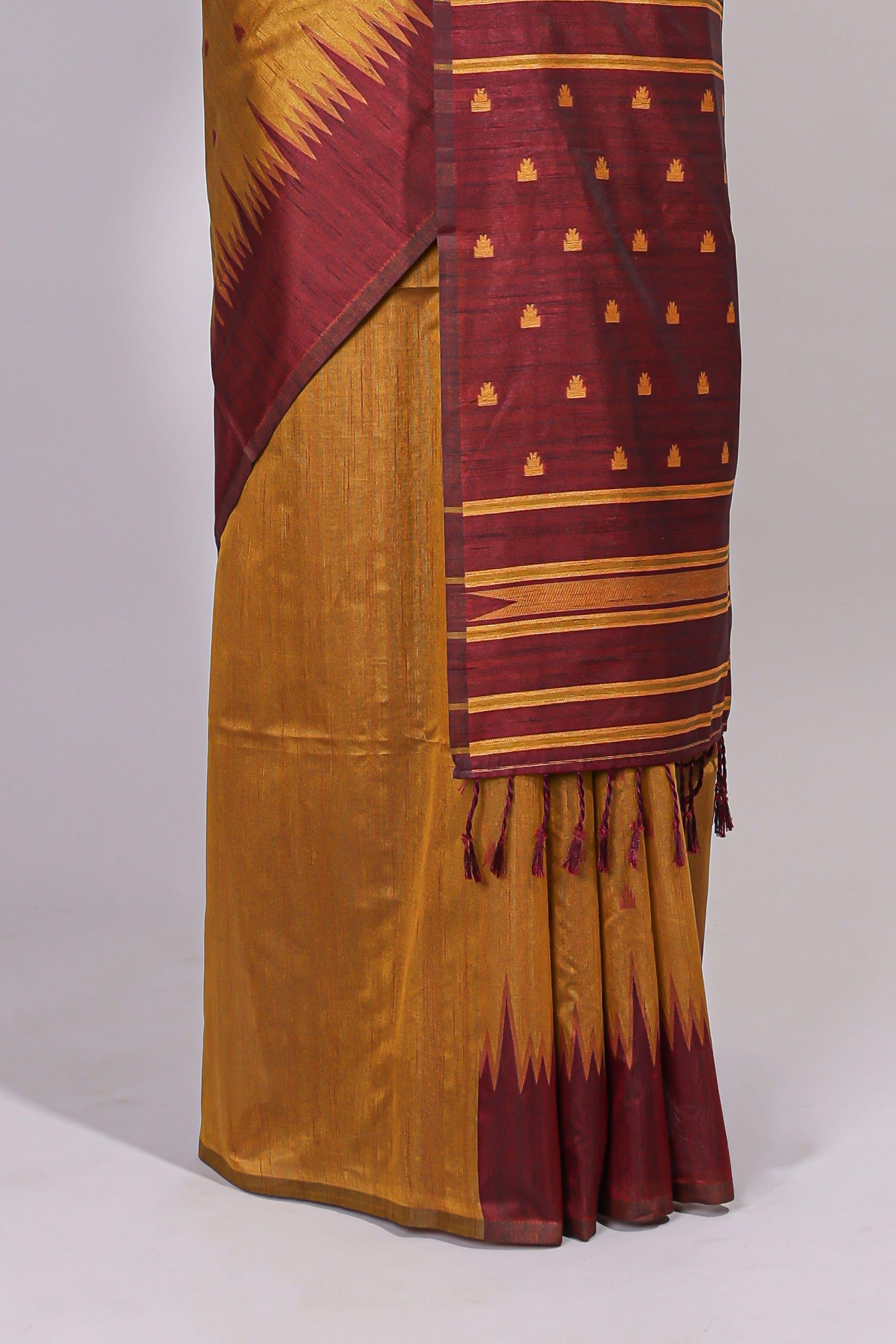 Mustard ikkat motifs design semi tussar saree with contrast border and striped blouse