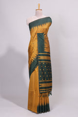 Mustard ikkat motifs design semi tussar saree with contrast green border and striped blouse