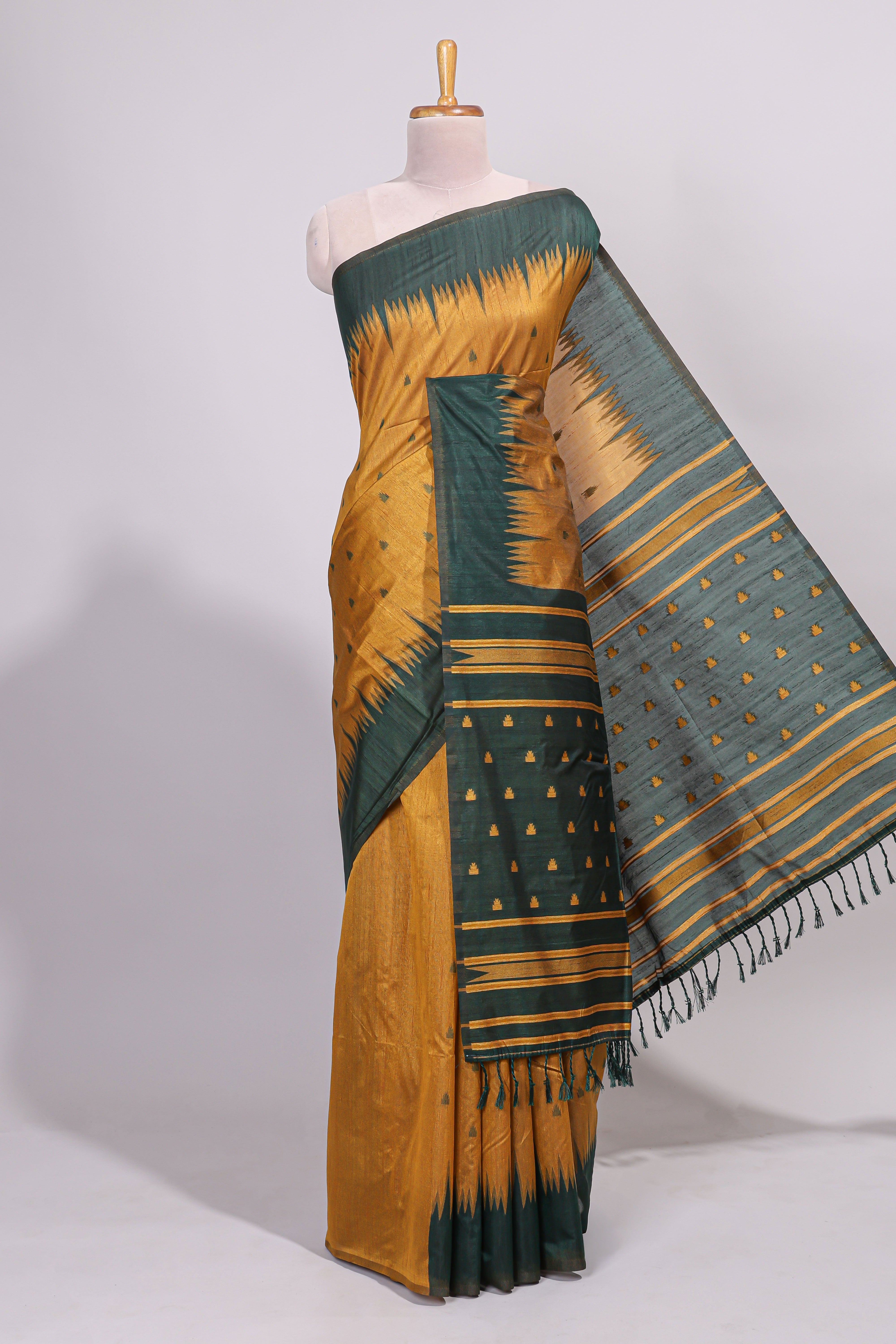 Mustard ikkat motifs design semi tussar saree with contrast green border and striped blouse